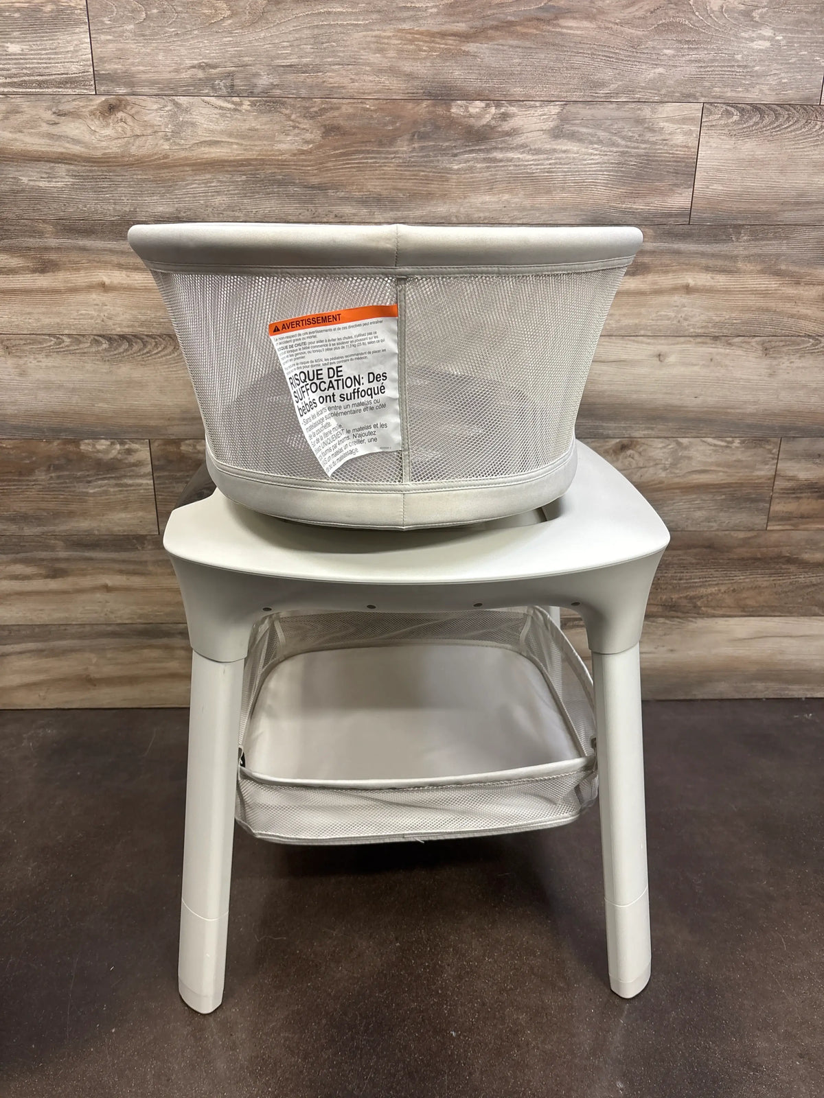 Front view of 4moms mamaRoo Sleep Bassinet with Storage Basket showcasing mesh sides and lower storage basket