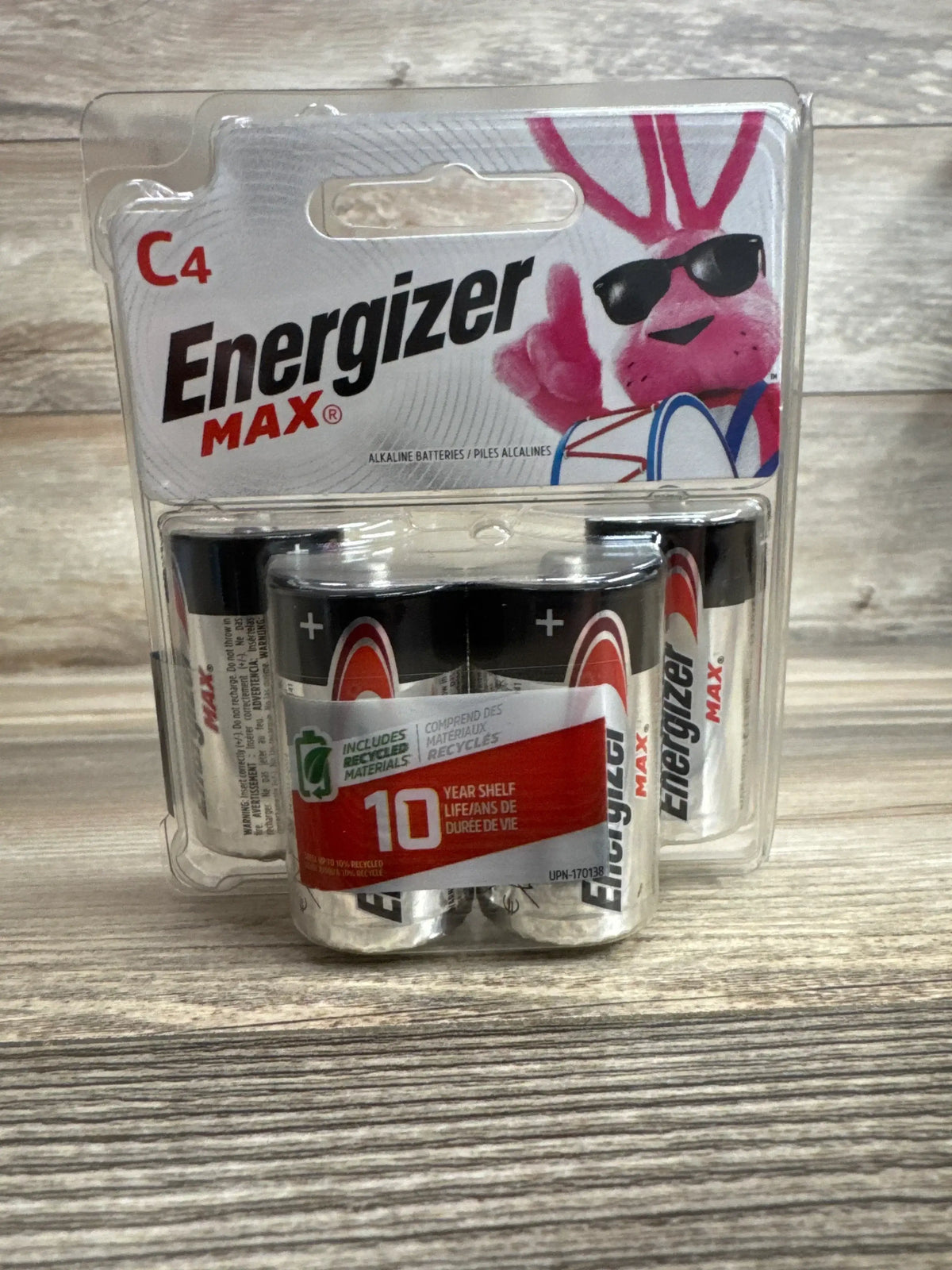 Front view of NEW Energizer Max C Batteries 4pk sealed blister pack showcasing pink bunny mascot and 10 year shelf life label with wood plank background