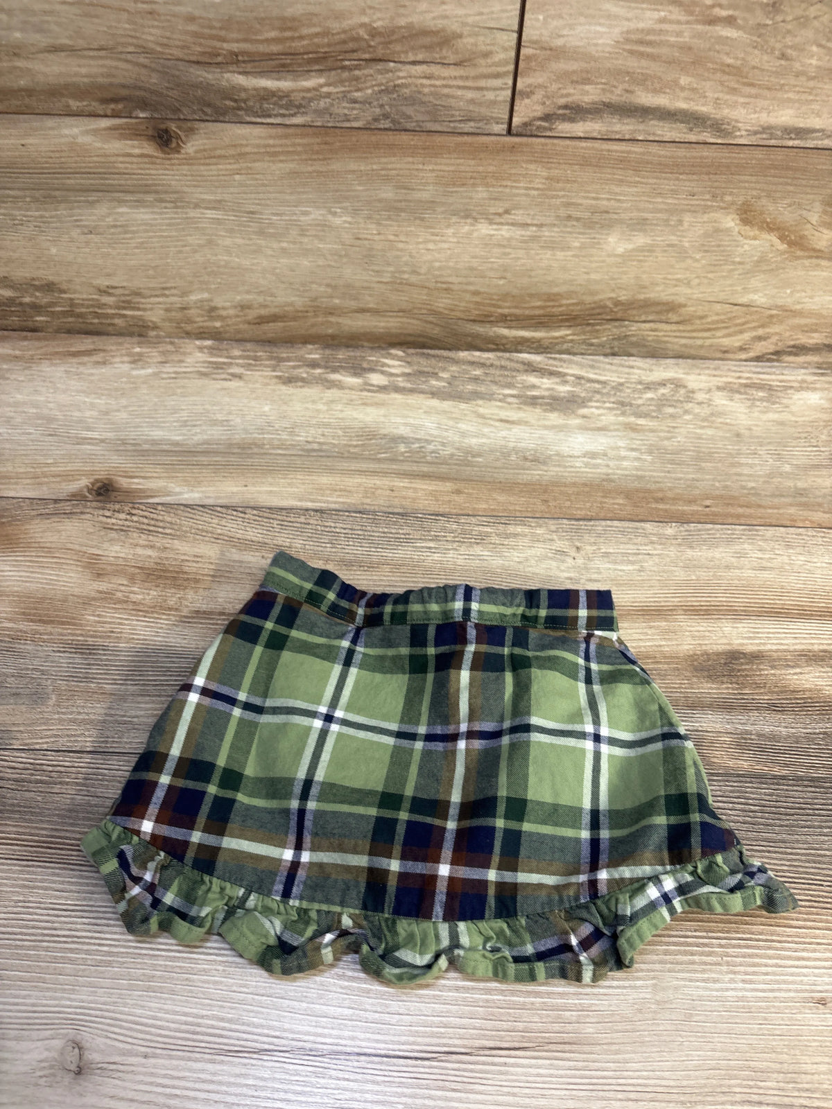 Front view of Janie & Jack The Equestrian Plaid Skirt in green, size 18 to 24 months, with ruffled hem