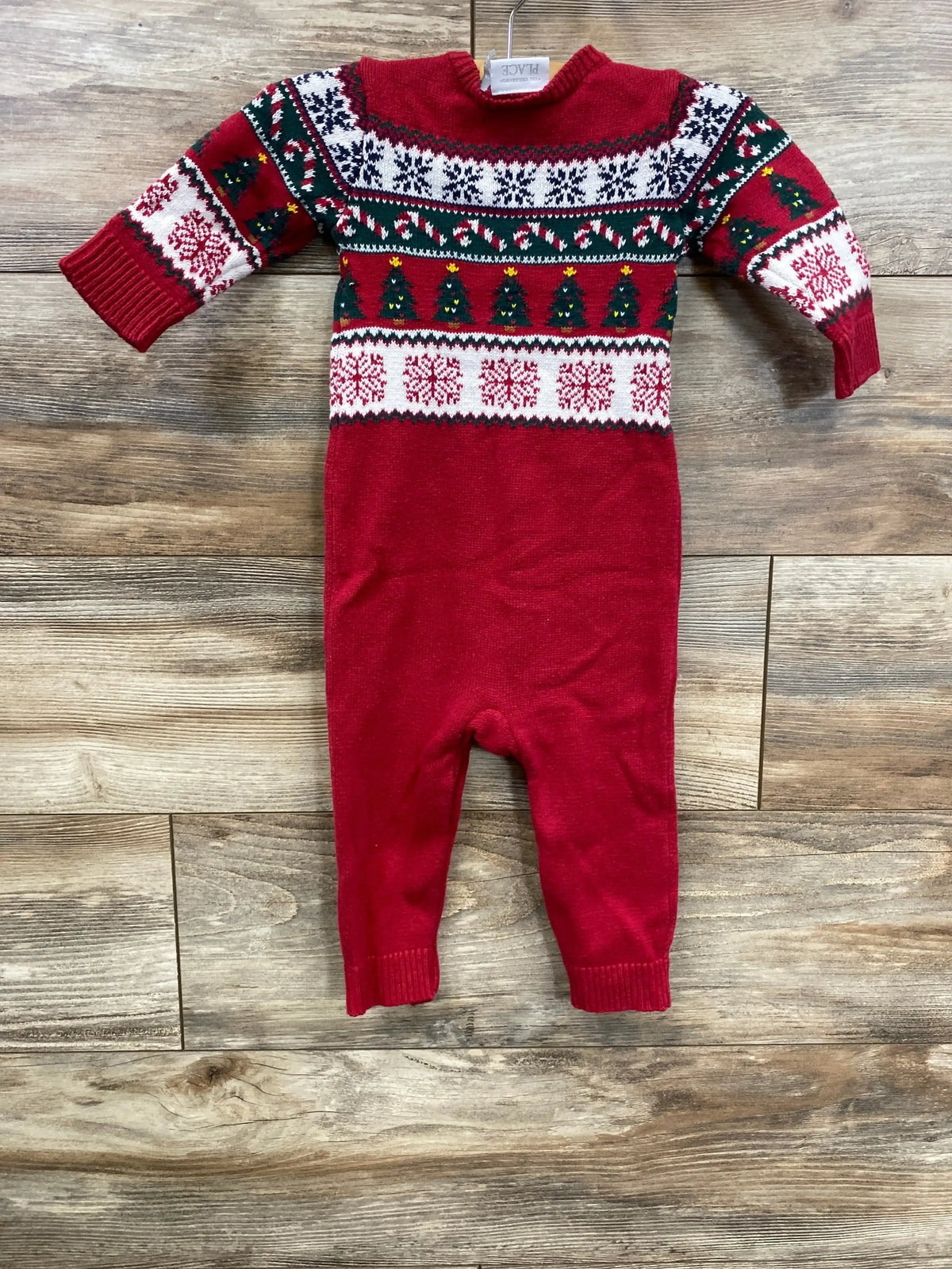 Red Christmas baby onesie with festive tree and snowflake patterns, holiday knit romper for infants