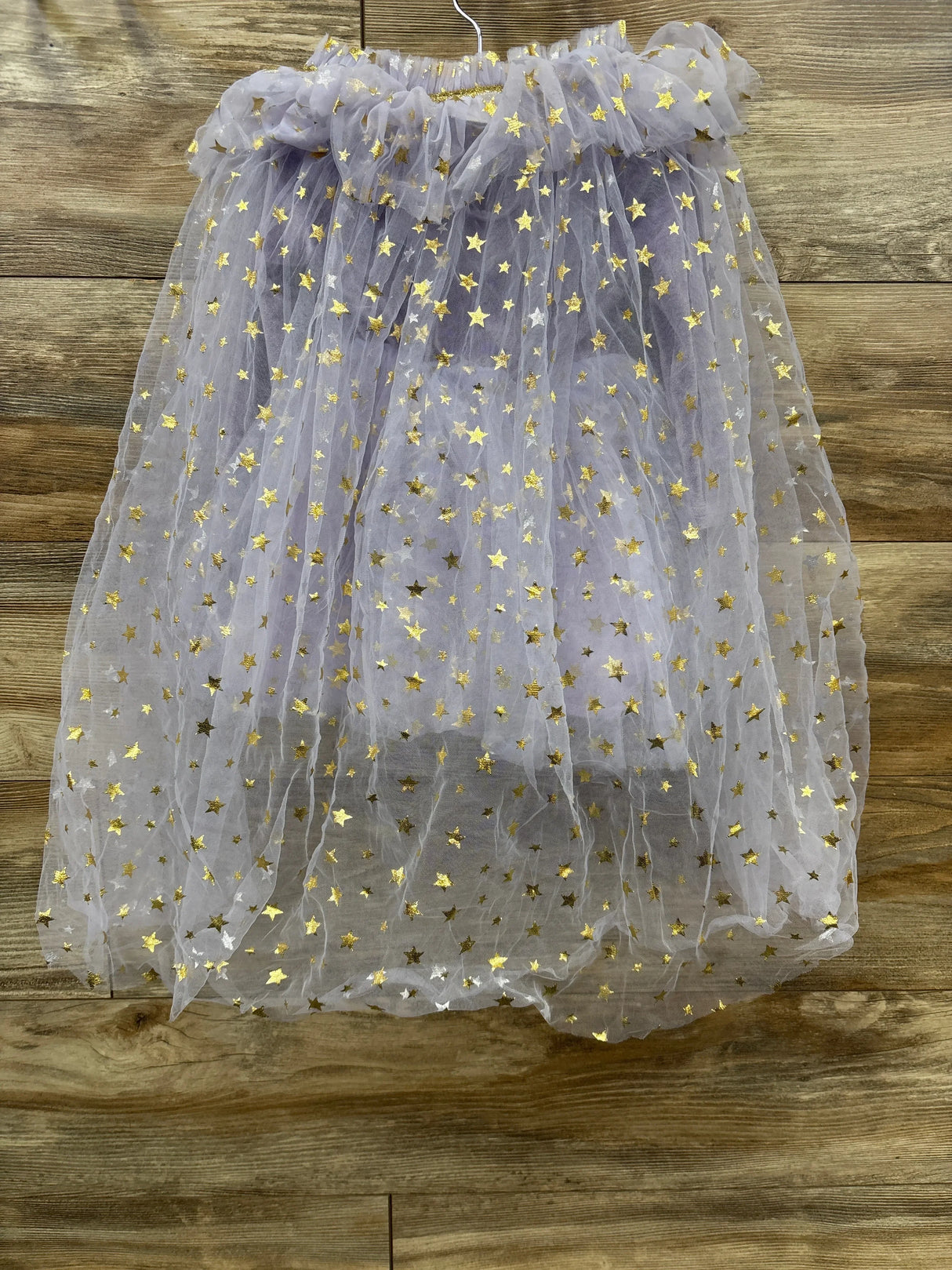 Purple tulle skirt with gold stars, perfect for kids' dress-up or costumes