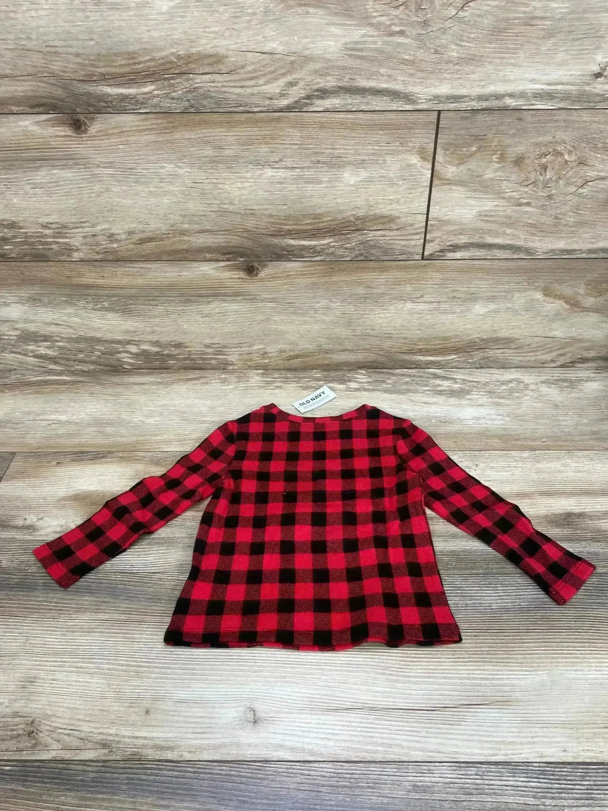 Back view of Old Navy toddler long-sleeve red and black buffalo check shirt size 2T on wood floor
