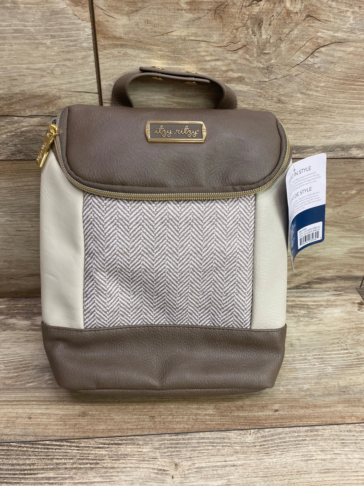 Front view of Itzy Ritzy Chill Like a Boss insulated bottle bag in Vanilla Latte with handle and patterned panel