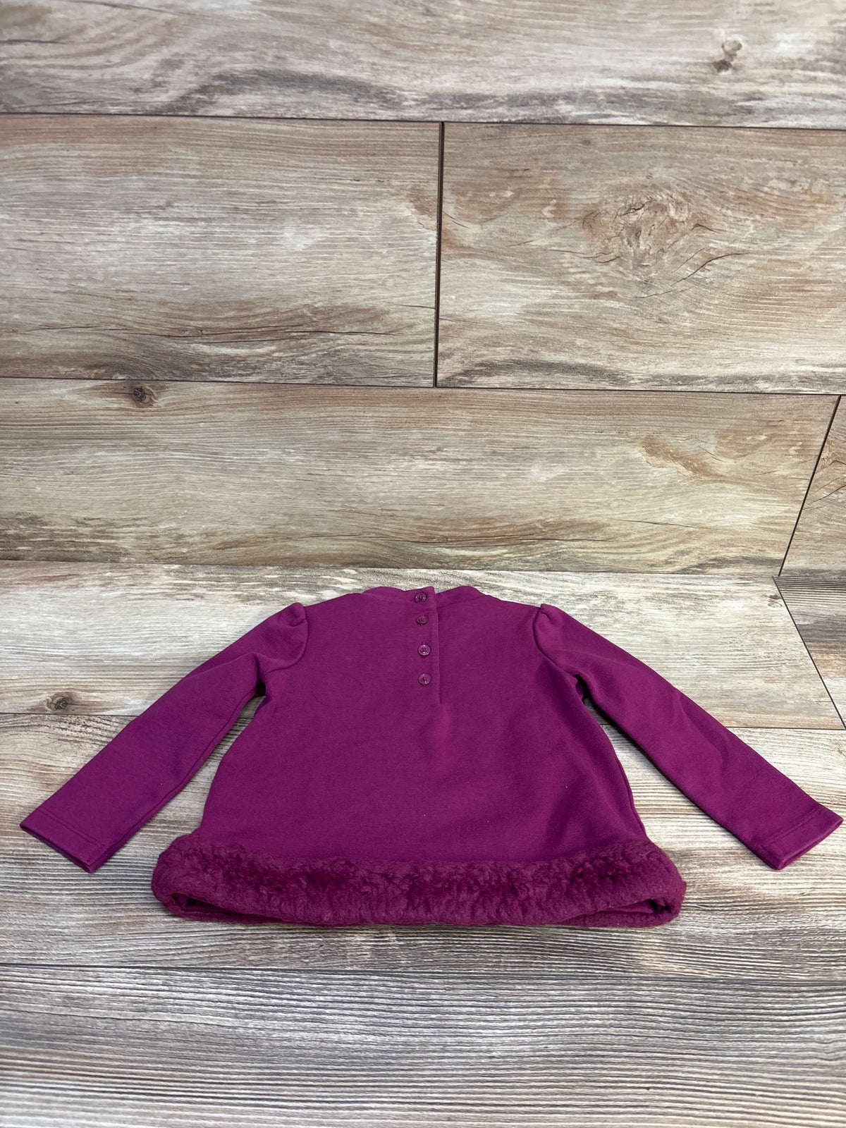 Janie & Jack purple ponte top with faux fur trim for infants, shown from the back.