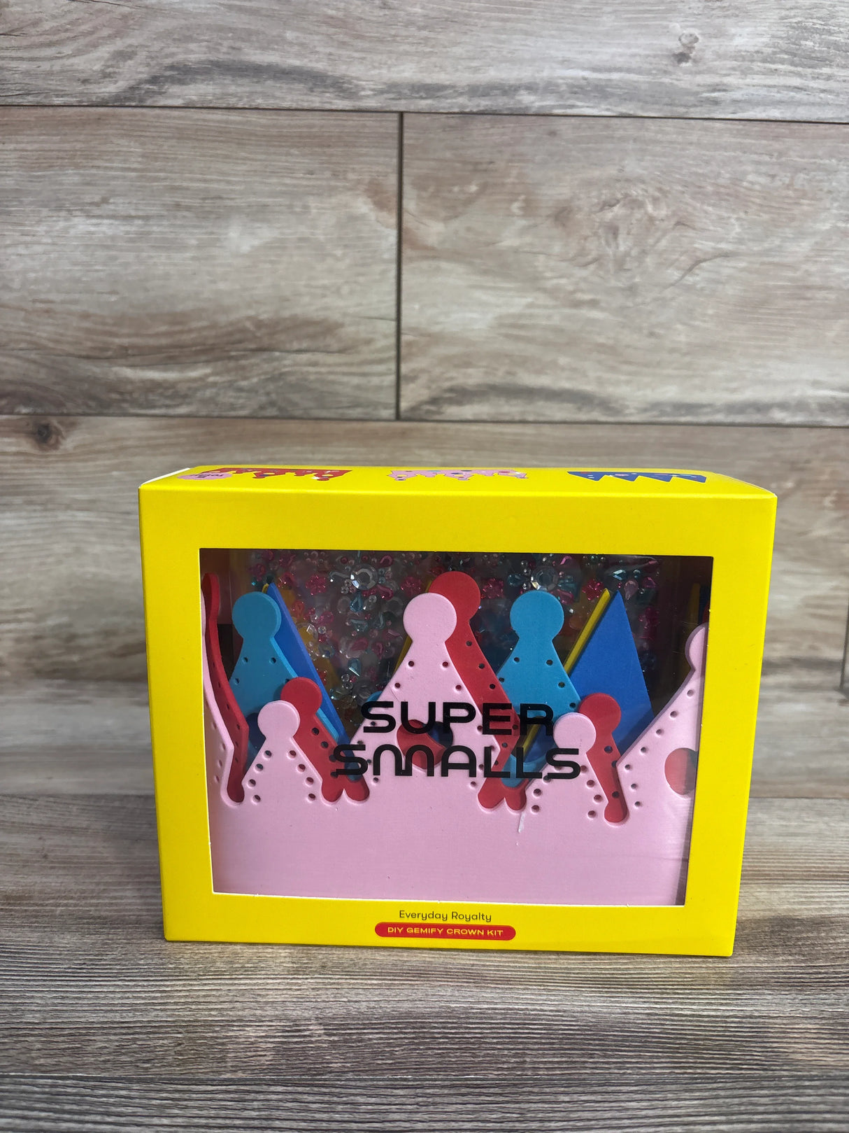 Super Smalls DIY Gemify Crown Kit in bright yellow box on wood background
