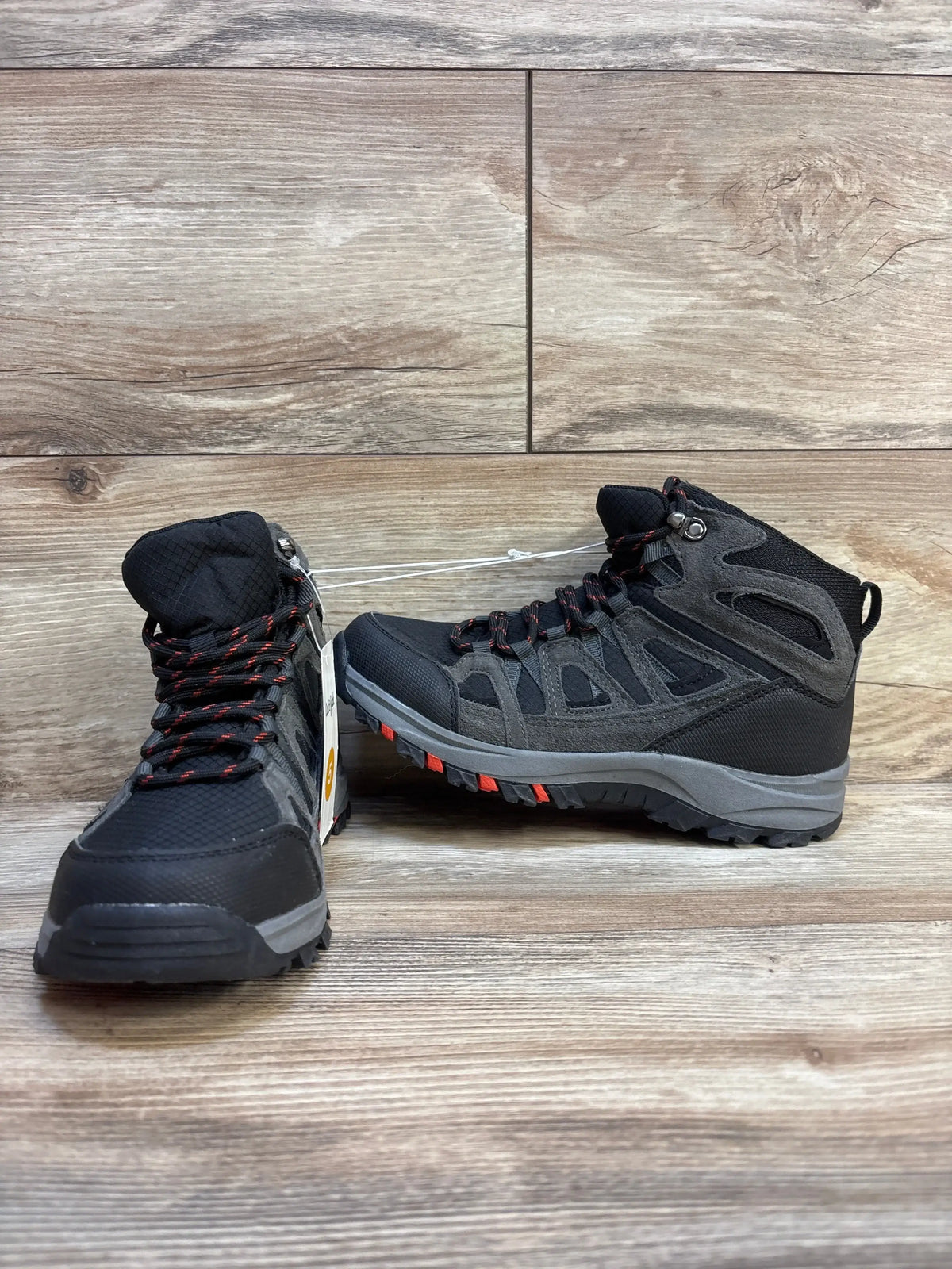 Side and front view of Cat and Jack Patsy hiking boots, size 5Y, mid-ankle lace-up, red accents, rugged tread on wood