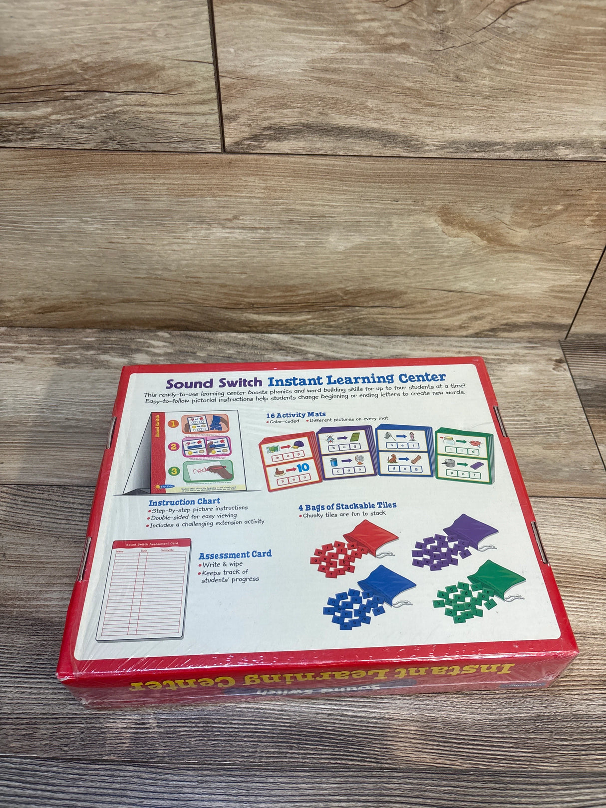 Sound Switch Instant Learning Center phonics kit box on wooden surface, includes activity mats, instruction chart, stackable tiles, assessment card for kids