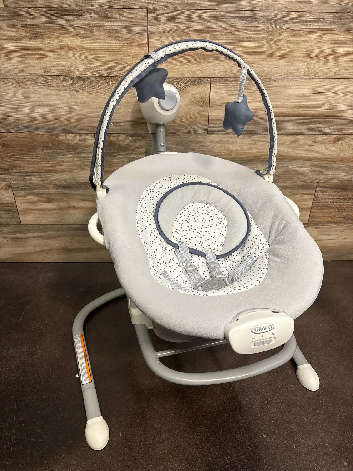 Front view of Graco Soothe ‘n Sway LX Swing with Portable Rocker in Derby showcasing padded seat and five-point harness