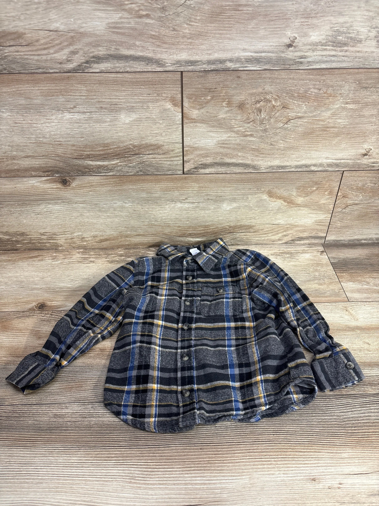 Kids flannel plaid button-up shirt with long sleeves, blue, yellow, and gray checks
