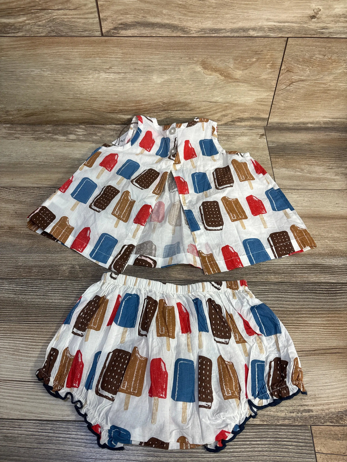 Flat lay of Pink Chicken NY Jaipur set showcasing a pintucked A-line top and matching popsicle-print bloomers