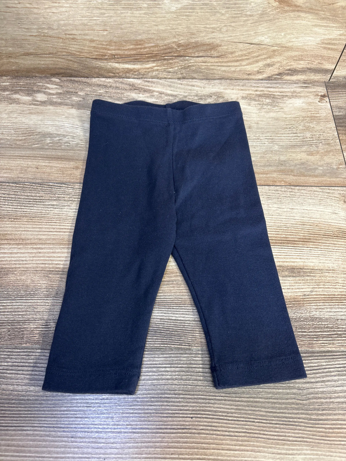 Front view of City Threads navy long bike shorts, showcasing long legs and elastic waistband on a wood-grain background