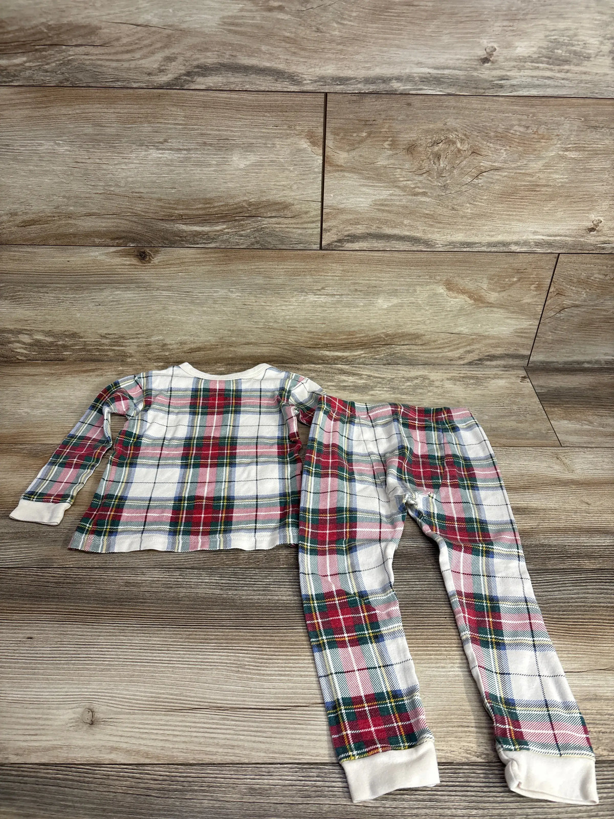 Kids plaid pajama set with long sleeves and pants, perfect for cozy nights and holiday sleepwear.