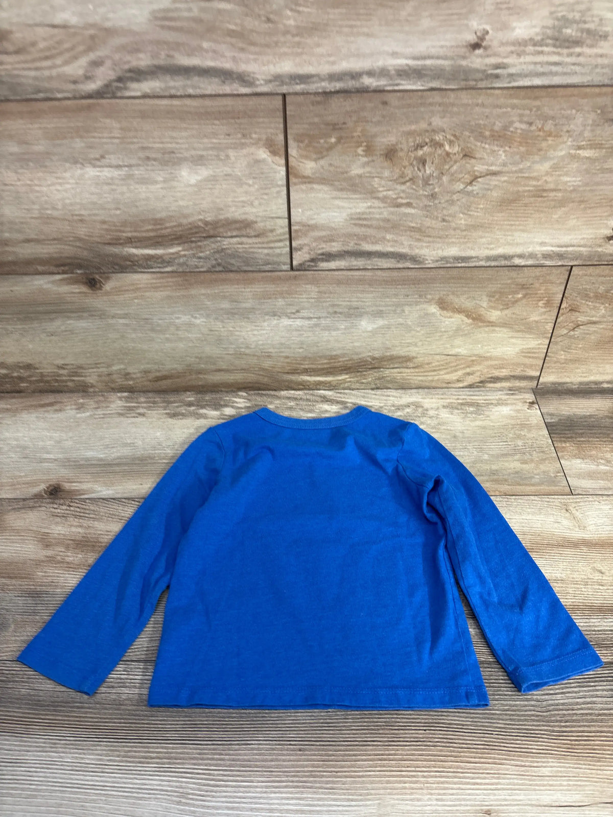 Back view of Children’s Place Nana Brings The Cookies I Bring The Hugs shirt in blue with long sleeves