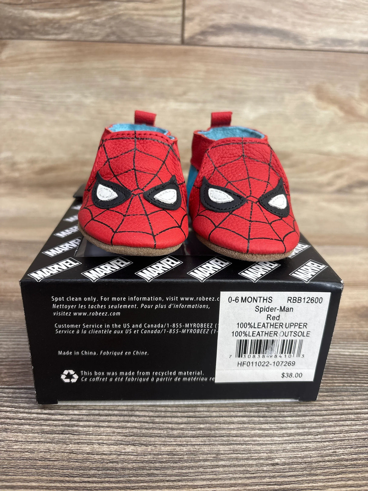 Red infant shoes with Spider-Man web design and eyes on black Marvel box, size 0-6 months, leather soles