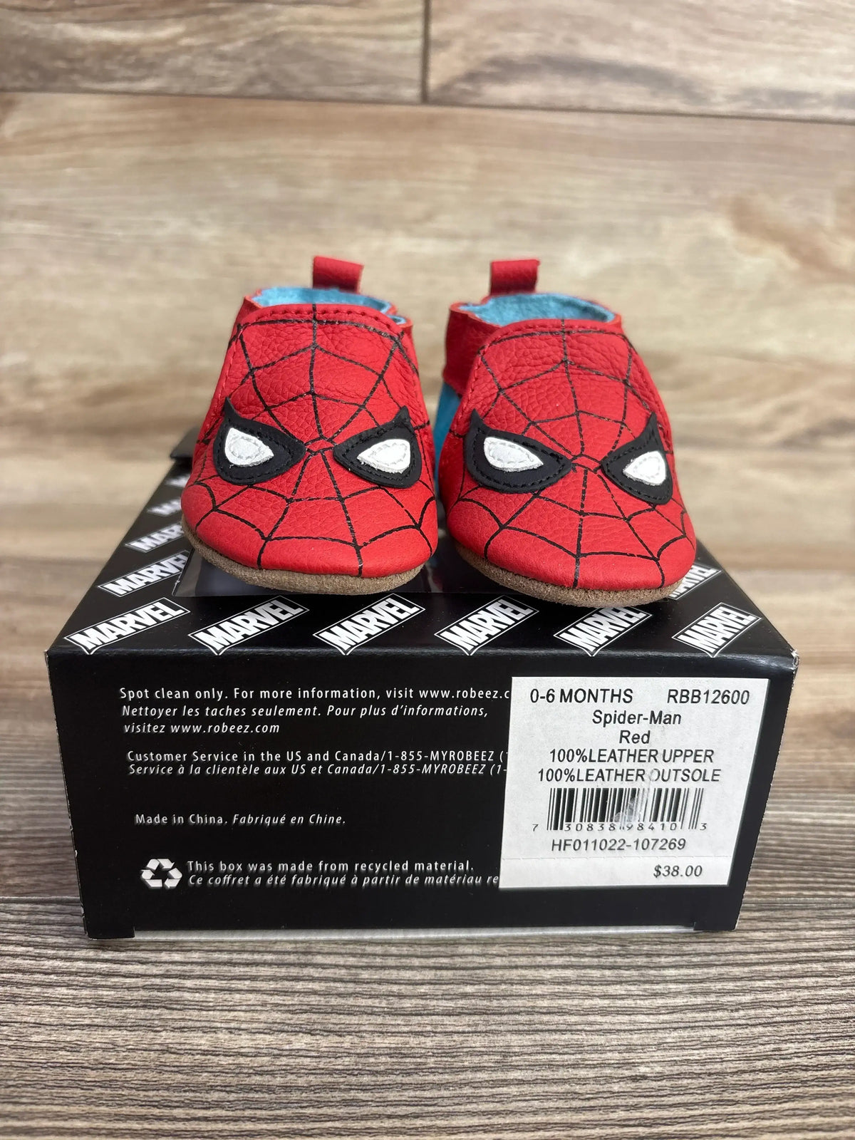 Red infant shoes with Spider-Man web design and eyes on black Marvel box, size 0-6 months, leather soles