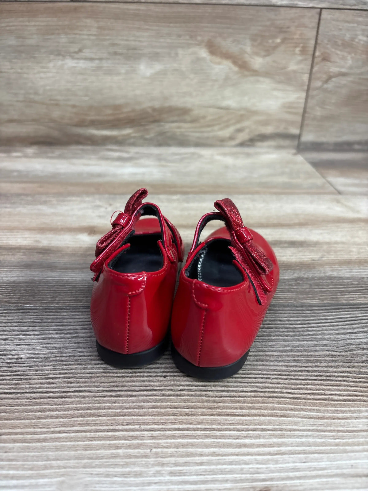 Rear view of red patent leather Rachel Shoes Lil' Molly Mary Jane bow flats for toddlers.
