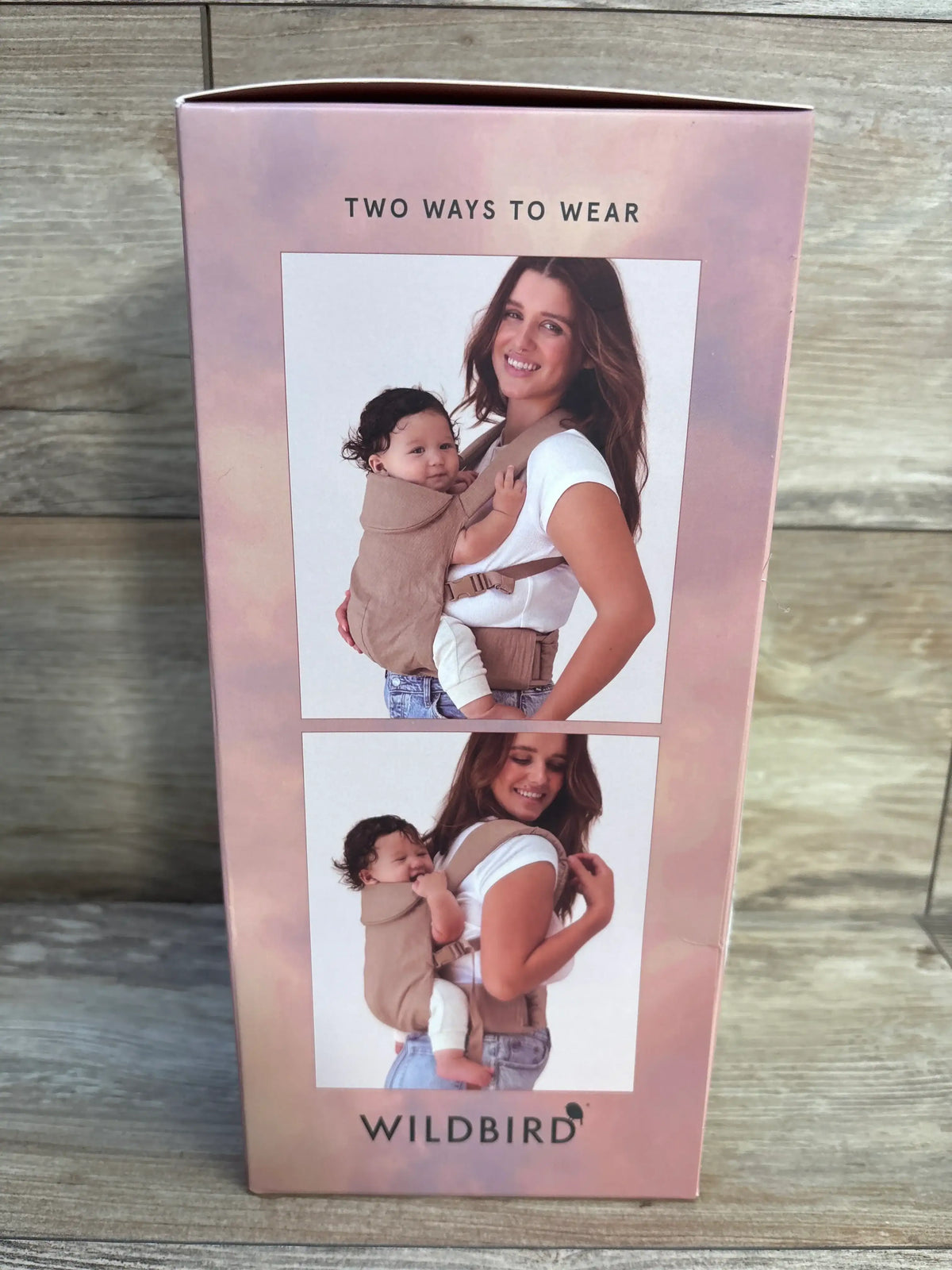 Front view of WildBird Aerial Carrier in Desert Lark box showing front and back carry positions with Two Ways to Wear text