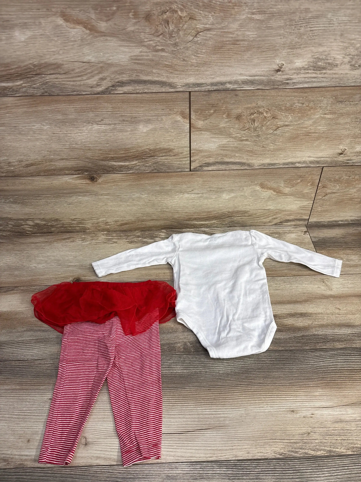 White long-sleeve baby onesie with red striped pants and tutu for infants