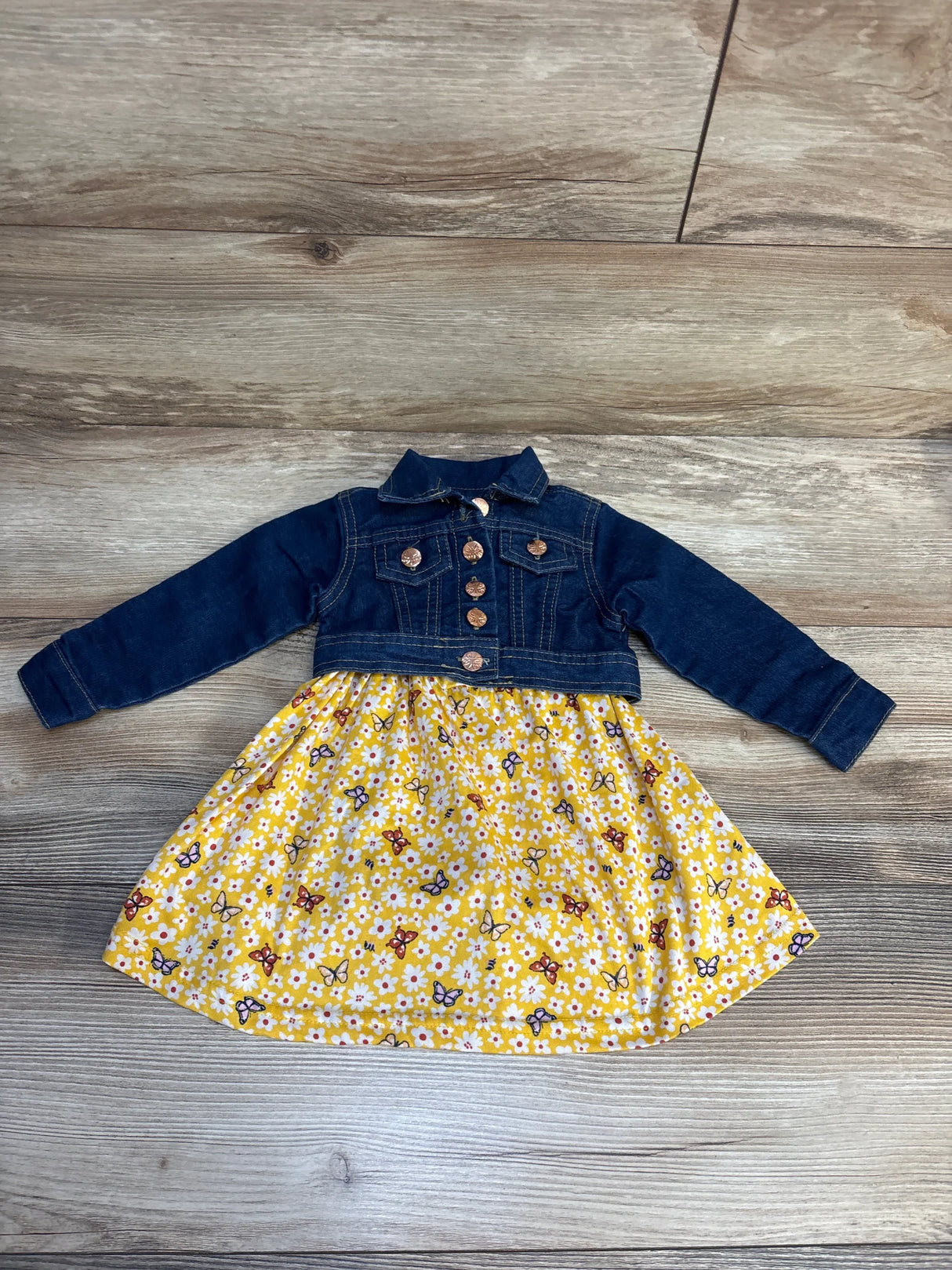 Girls' denim jacket dress with yellow floral butterfly skirt on wood floor