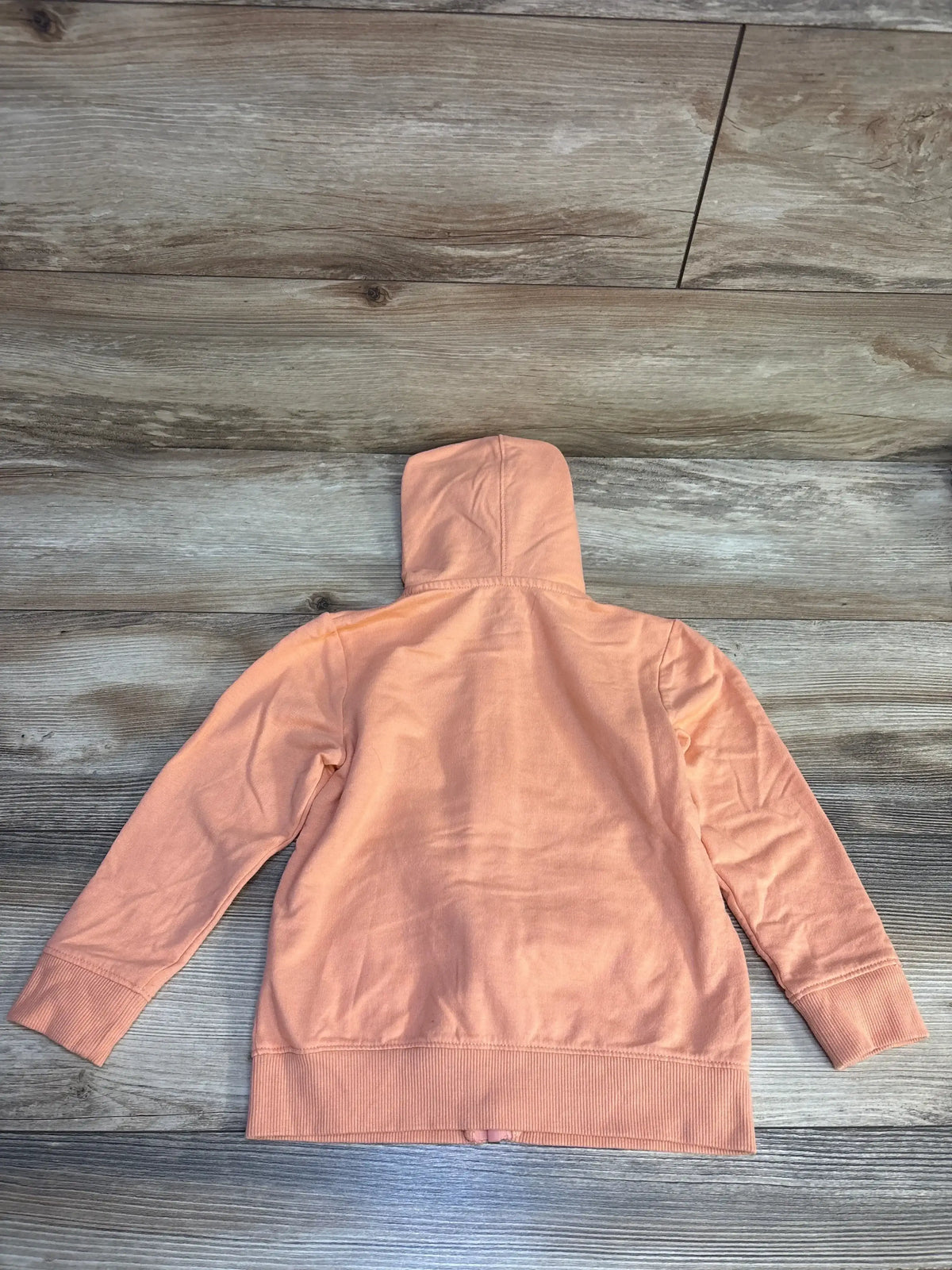 Back view of Cat & Jack coral full-zip toddler jacket (4T) showing hood and ribbed hem on wood floor