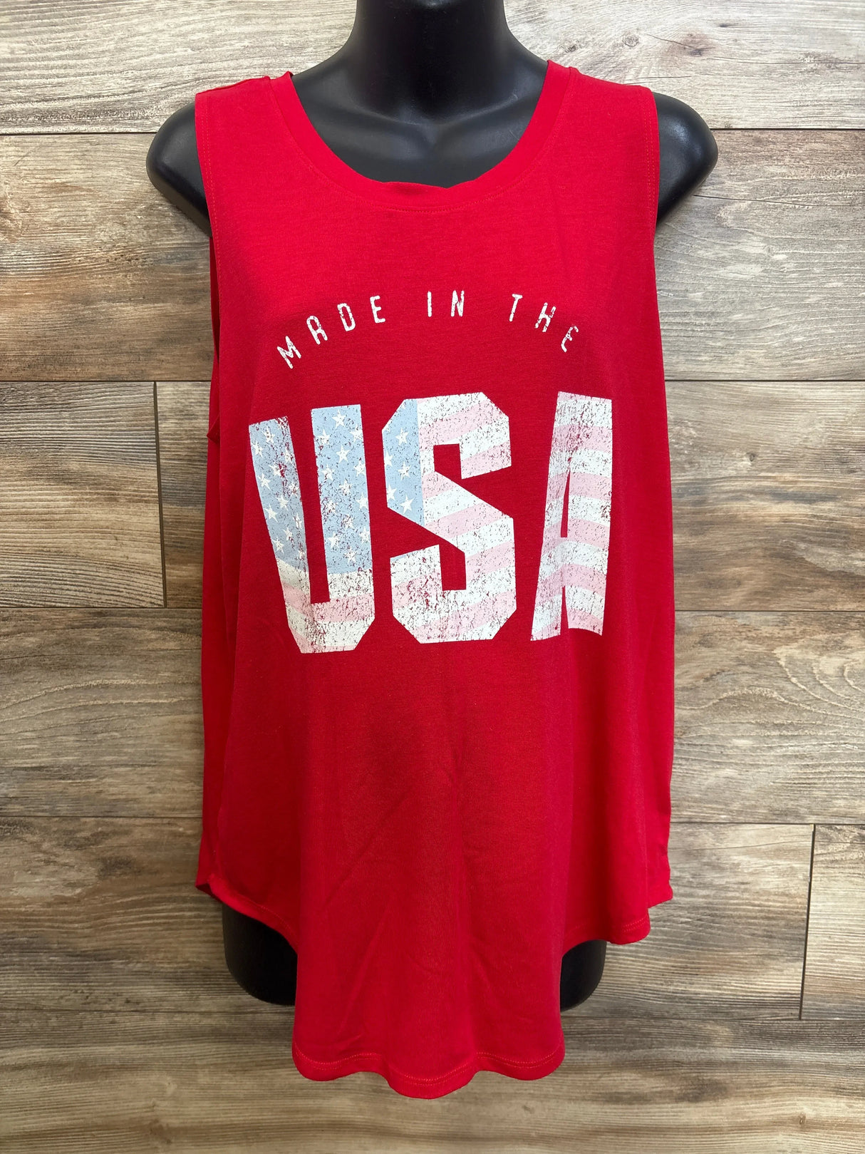 Front of red Isabel Maternity tank top with distressed USA flag print, scoop neckline on black mannequin, wood background