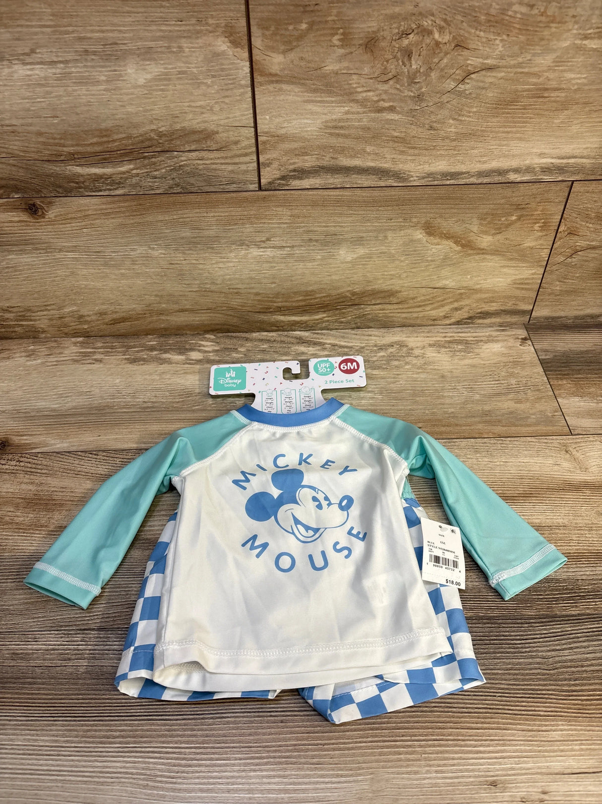 Mickey Mouse infant swim set with blue sleeves and checkered shorts, size 6M