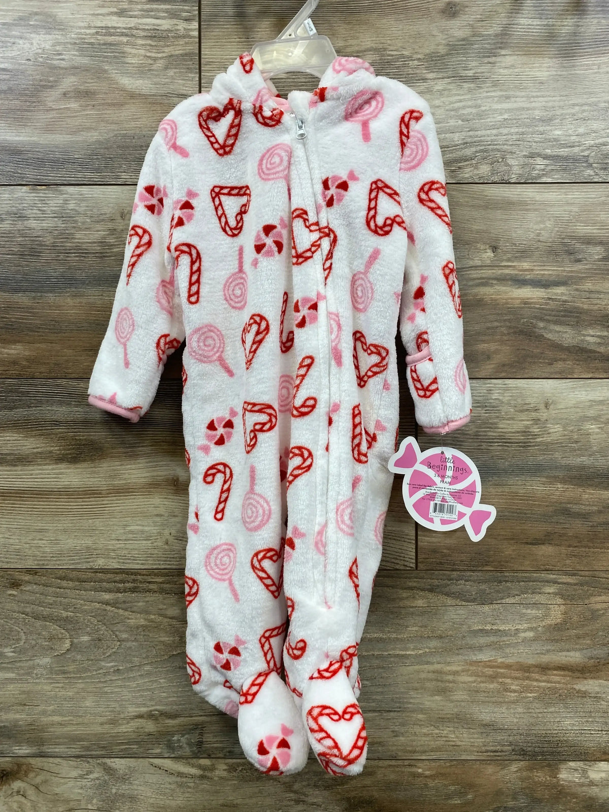 Infant fleece footed pajamas with red candy cane and pink lollipop print, hooded, zip front