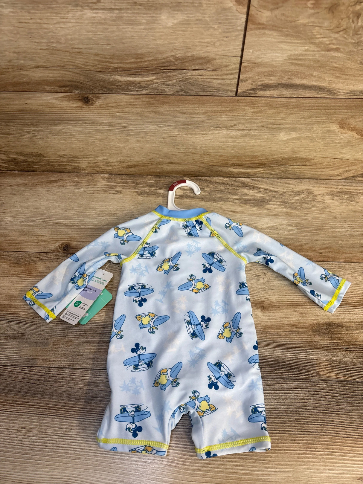 Baby boys' Disney surf print rash guard swimsuit, 6M, with eco-friendly lining, on hanger