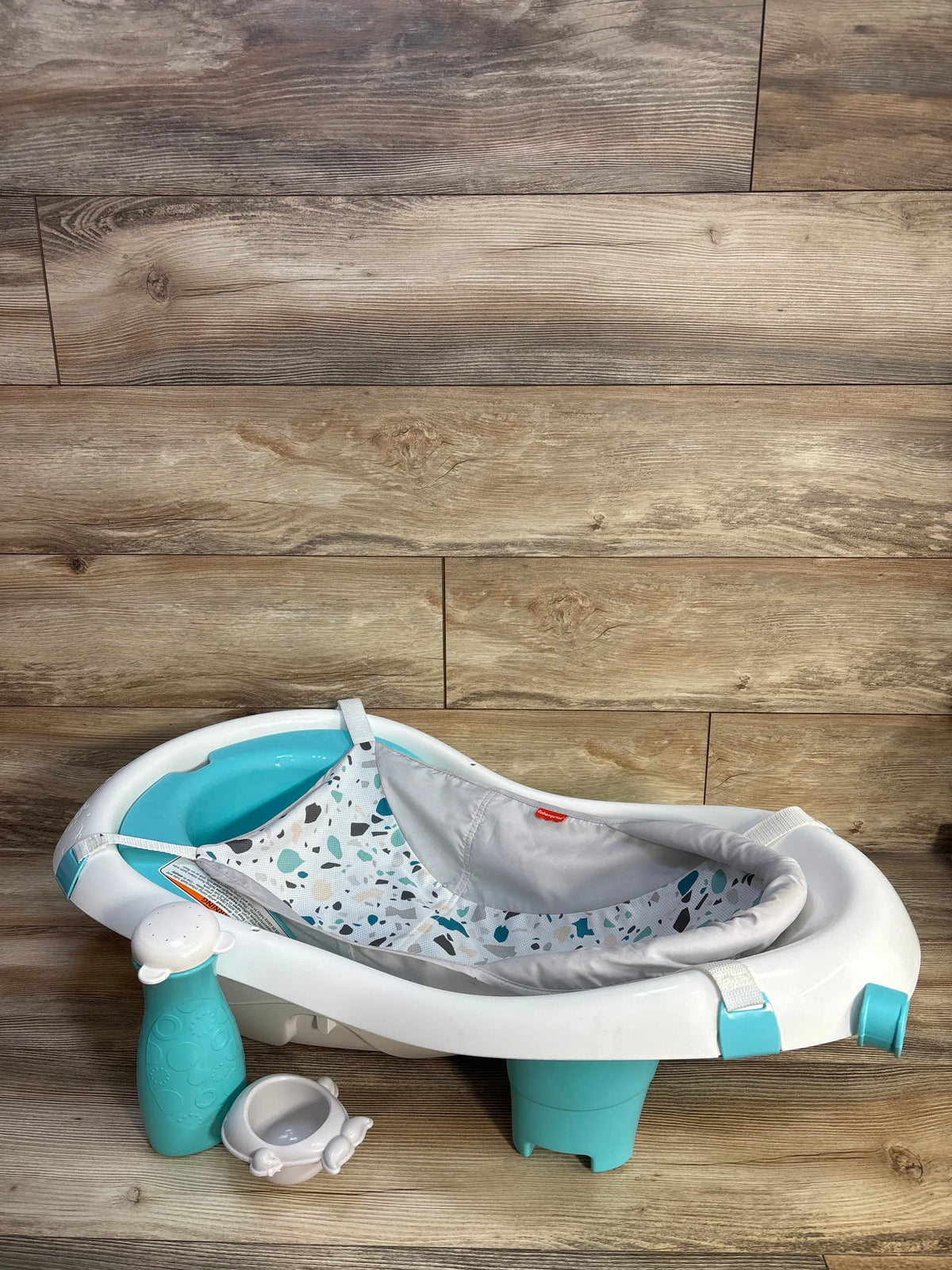 Fisher-Price 4-in-1 Sling ‘n Seat Bath Tub in white and teal with patterned sling