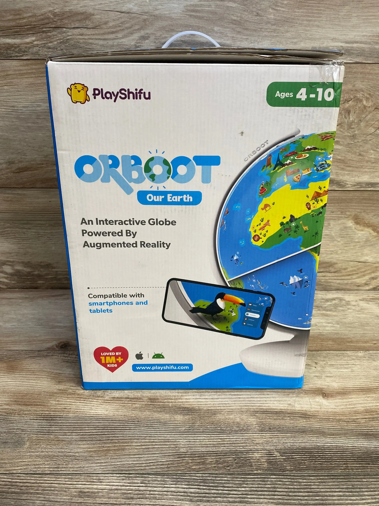Front view of PlayShifu Orboot boxed interactive AR globe showing globe artwork and ‘An Interactive Globe Powered By Augmented Reality’ text on wooden surface