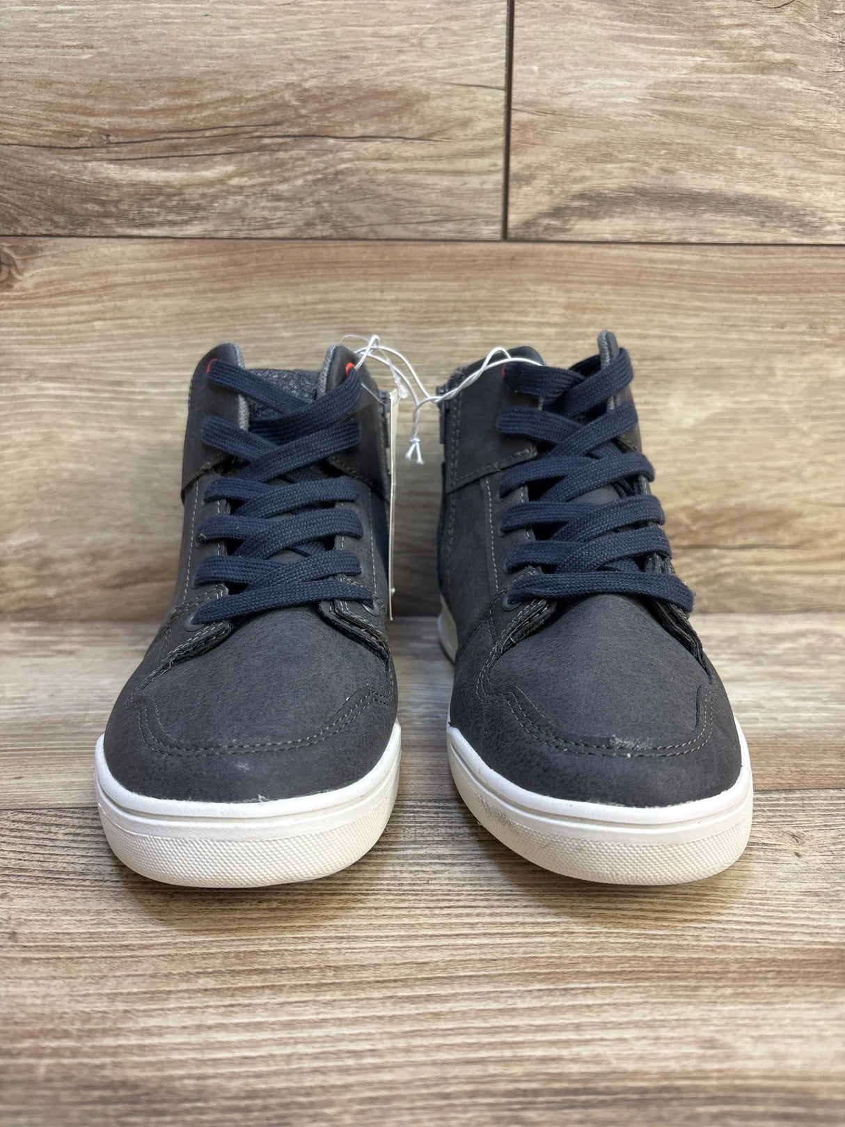 Front view of Art Class Geoff high-top sneakers in grey, size 4Y, showcasing navy laces and white rubber soles on wood floor