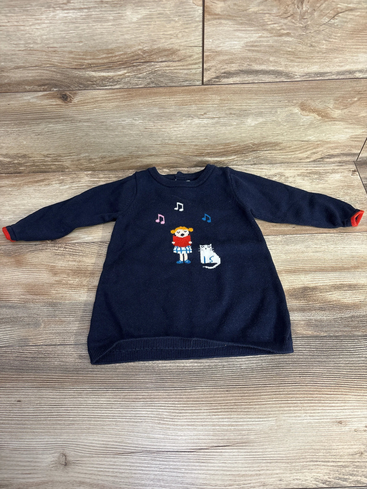 Navy blue toddler sweater dress with musical girl and cat design, long sleeves