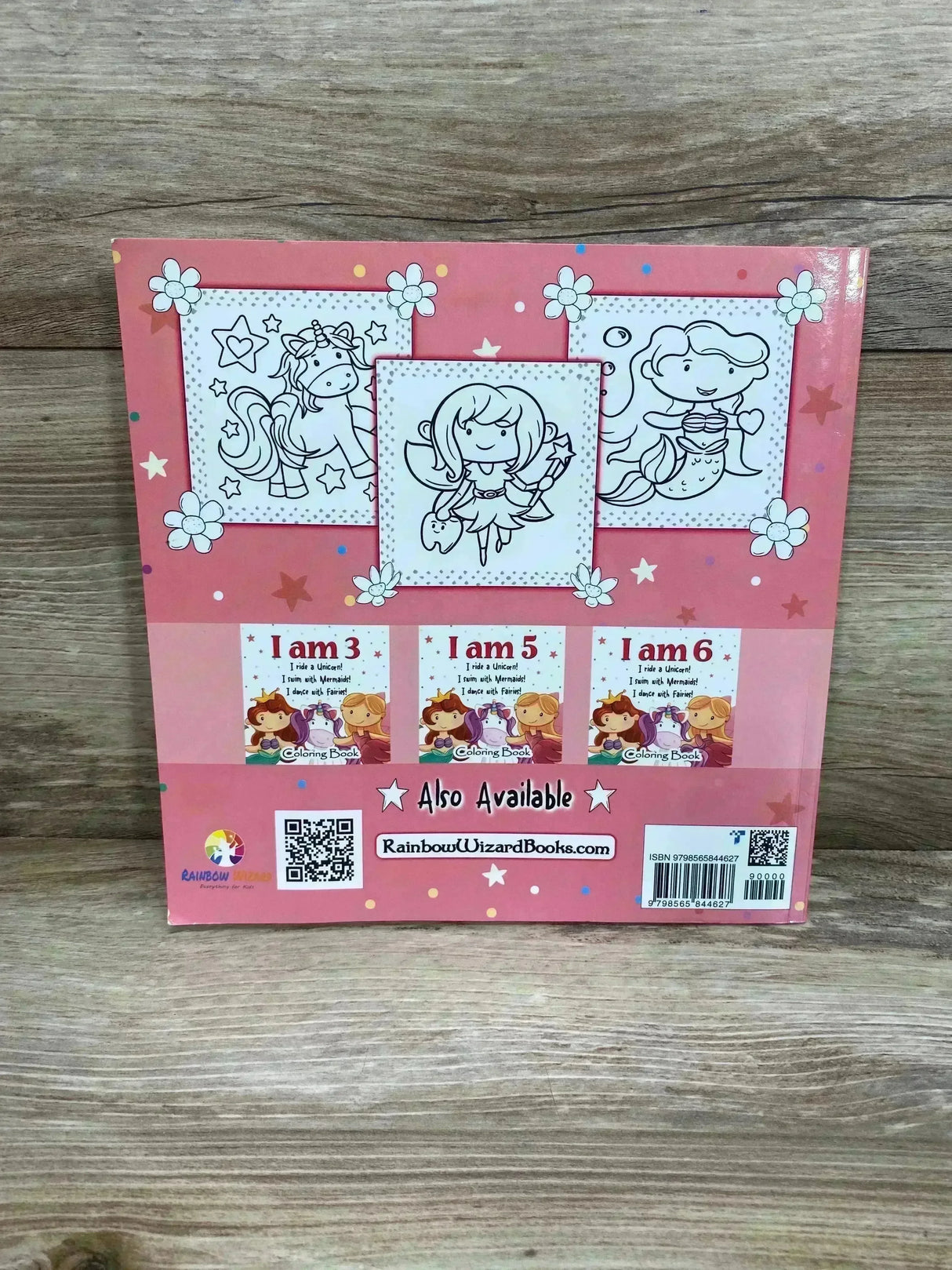 Back cover of I am 4 coloring book showing unicorn, fairy, mermaid line drawings, thumbnails, QR codes, and barcode on wood