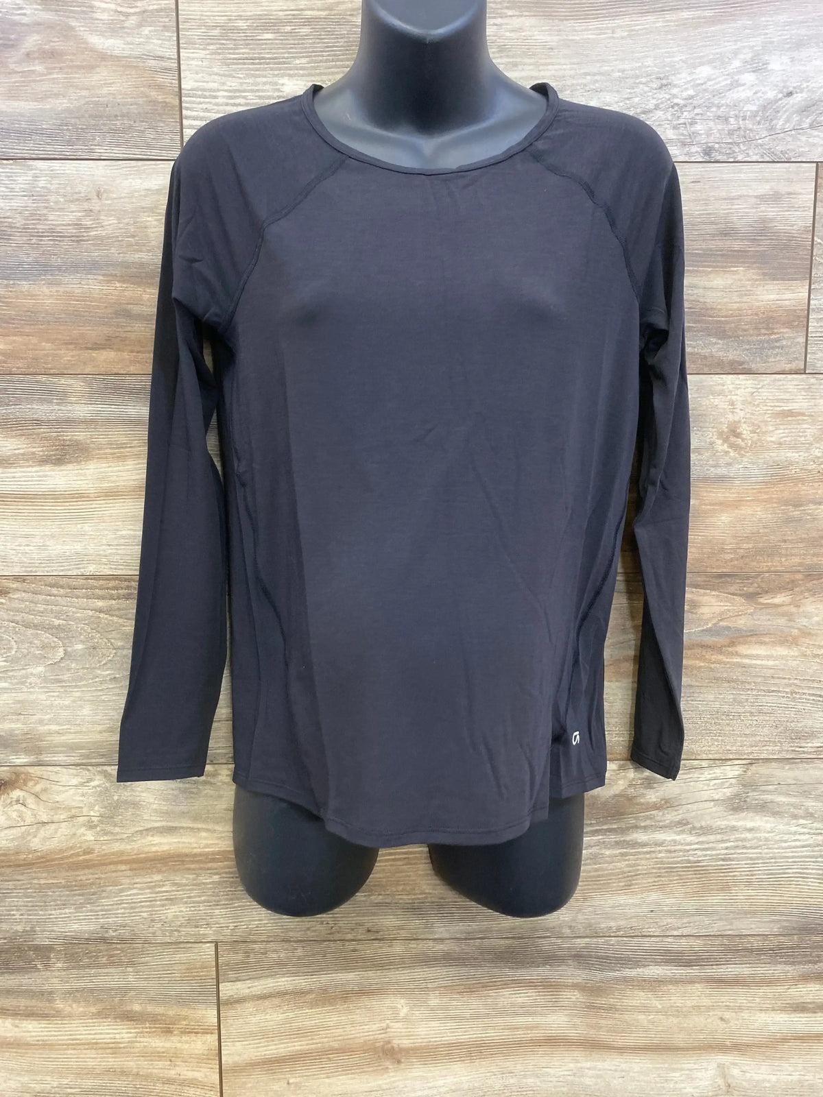 Front view of black Gap Breathe maternity long sleeve shirt size XS showing crew neckline and relaxed fit on mannequin