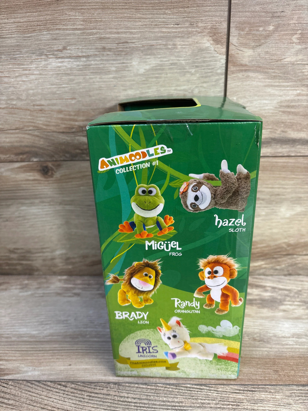 Animoodles Collection #1 toy box featuring plush frog, sloth, lion, orangutan, and unicorn characters.