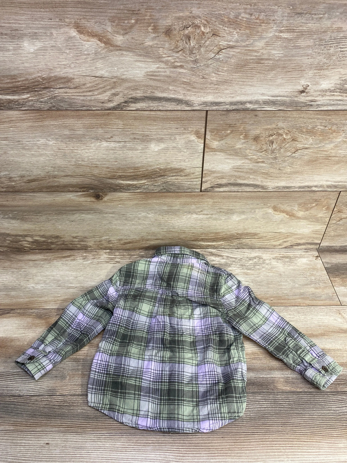 Back view of Cat & Jack 2T plaid button-up shirt showing green and purple plaid pattern and long sleeves on wooden floor