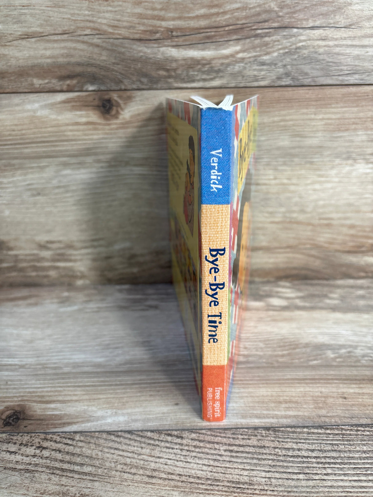 Children's book 'Bye-Bye Time' by Verdick, Free Spirit Publishing, on wood background