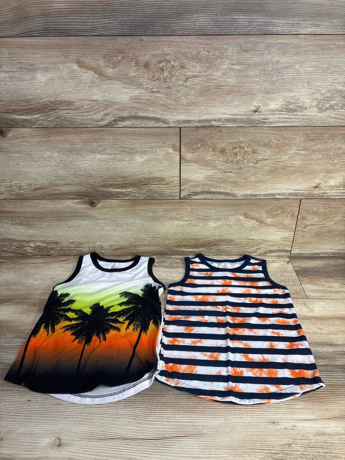 Front view of 2-pack Wonder Nation white toddler tank tops showing scoop neck and sleeveless design on plain white background