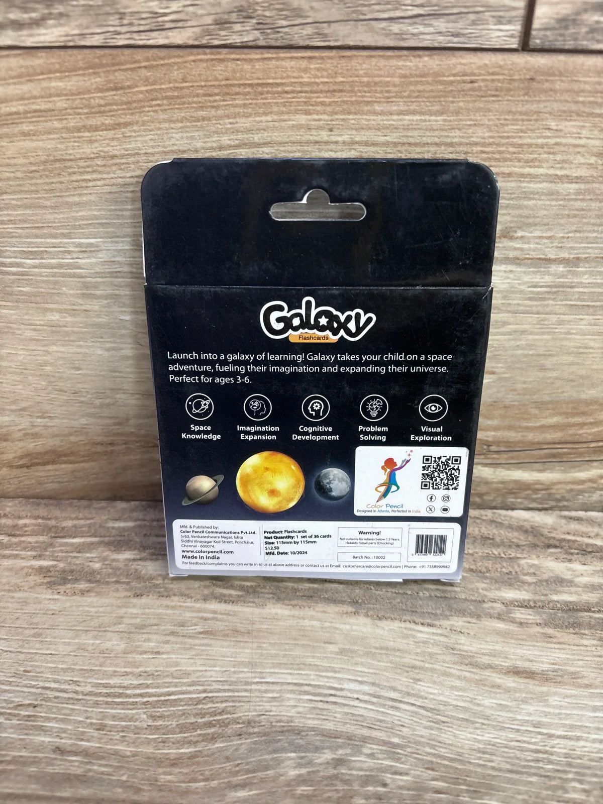 Galaxy flashcards box for kids, space learning set on wooden background, back packaging shown.