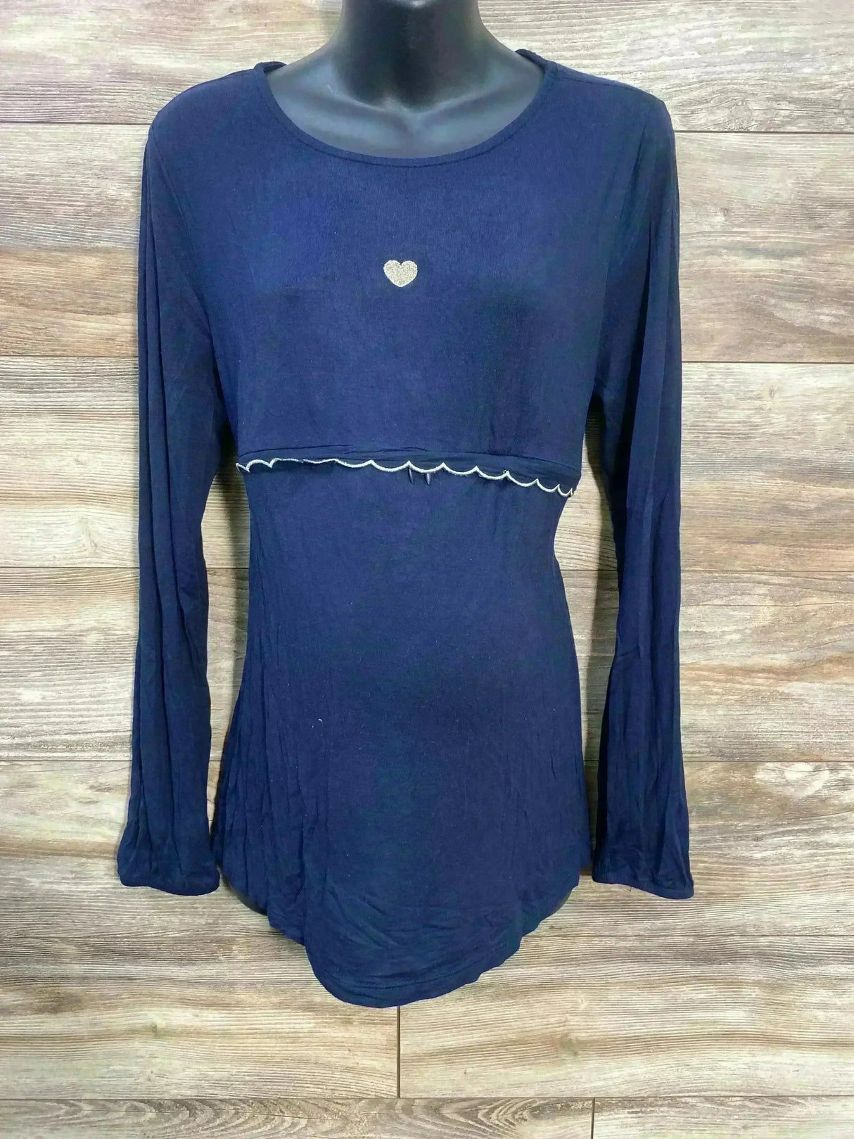 Front view of Vertbaudet navy long-sleeve nursing top with layered nursing panel, scalloped trim and gold heart on wood