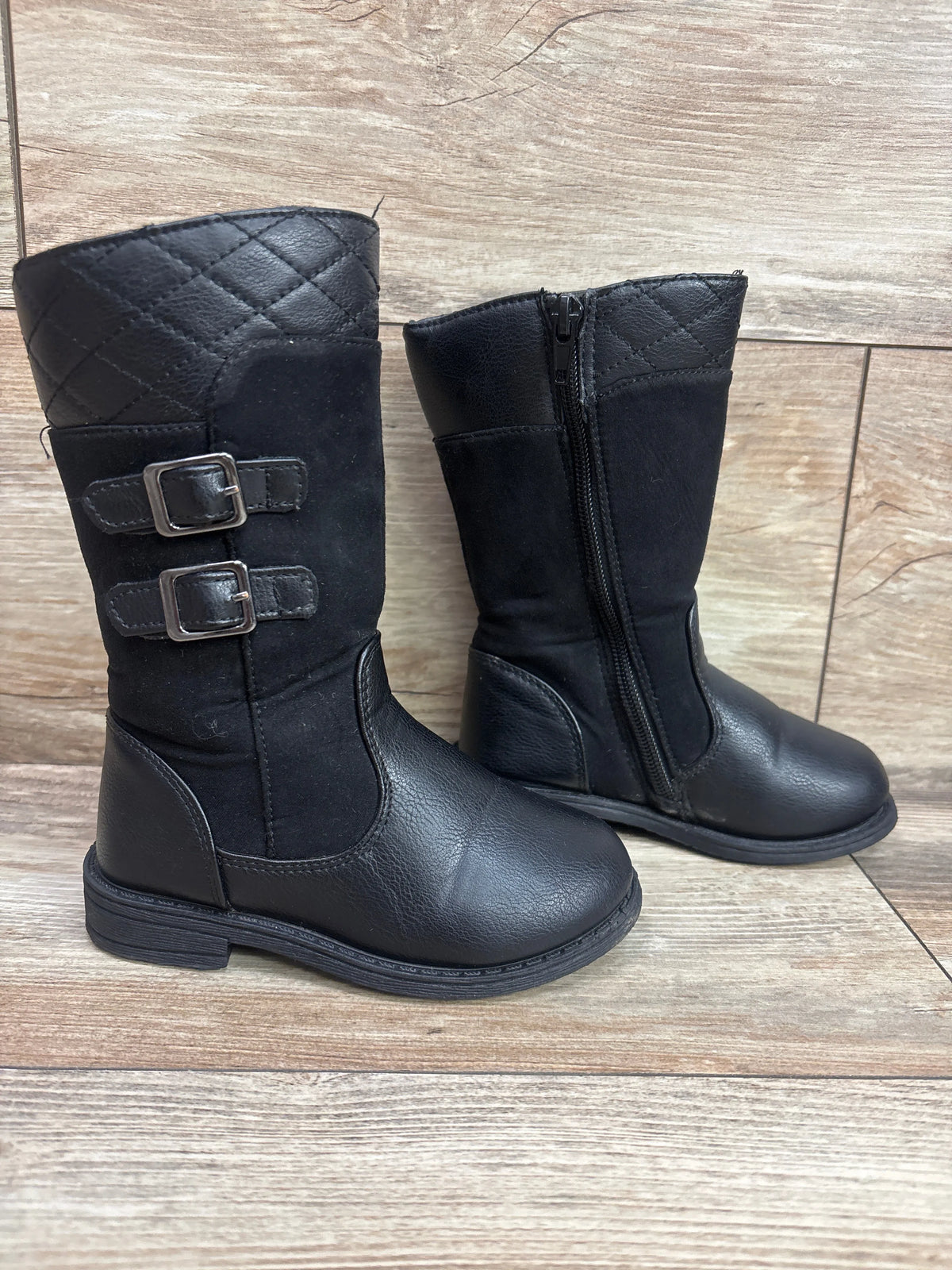 Front and side views of Rachel Shoes Lil’ Courtlyn boots in black, showing quilted shafts, buckle straps, and side zipper