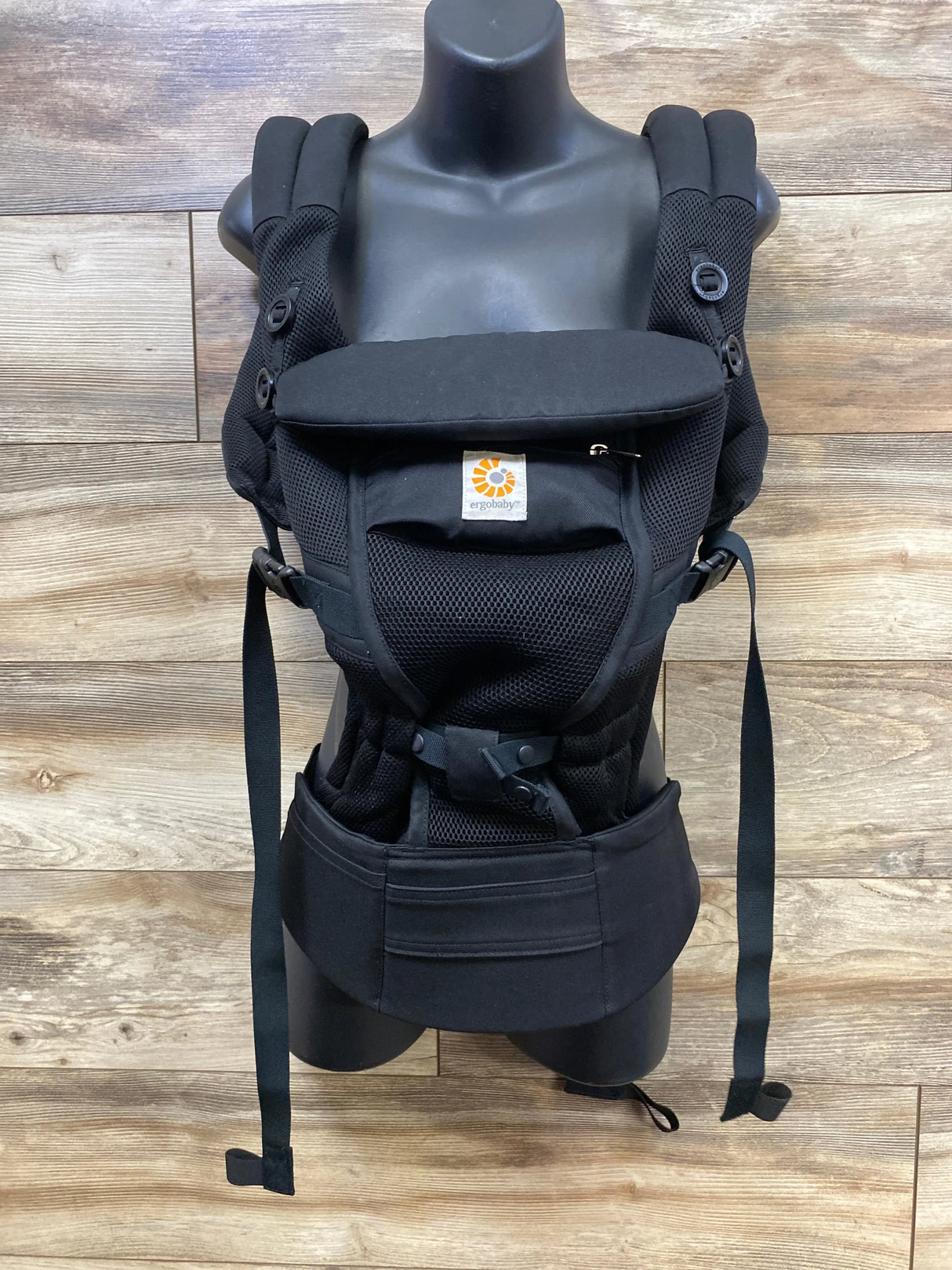 Front view of Ergobaby Adapt baby carrier in Onyx Black showing Cool Air Mesh panel, padded shoulder straps and wide waist belt