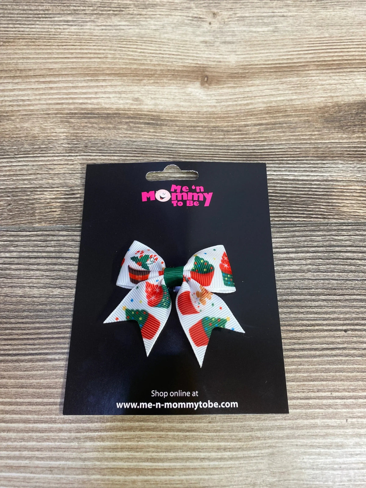 Festive holiday bow with Christmas tree and cupcake print, perfect for kids' holiday outfits