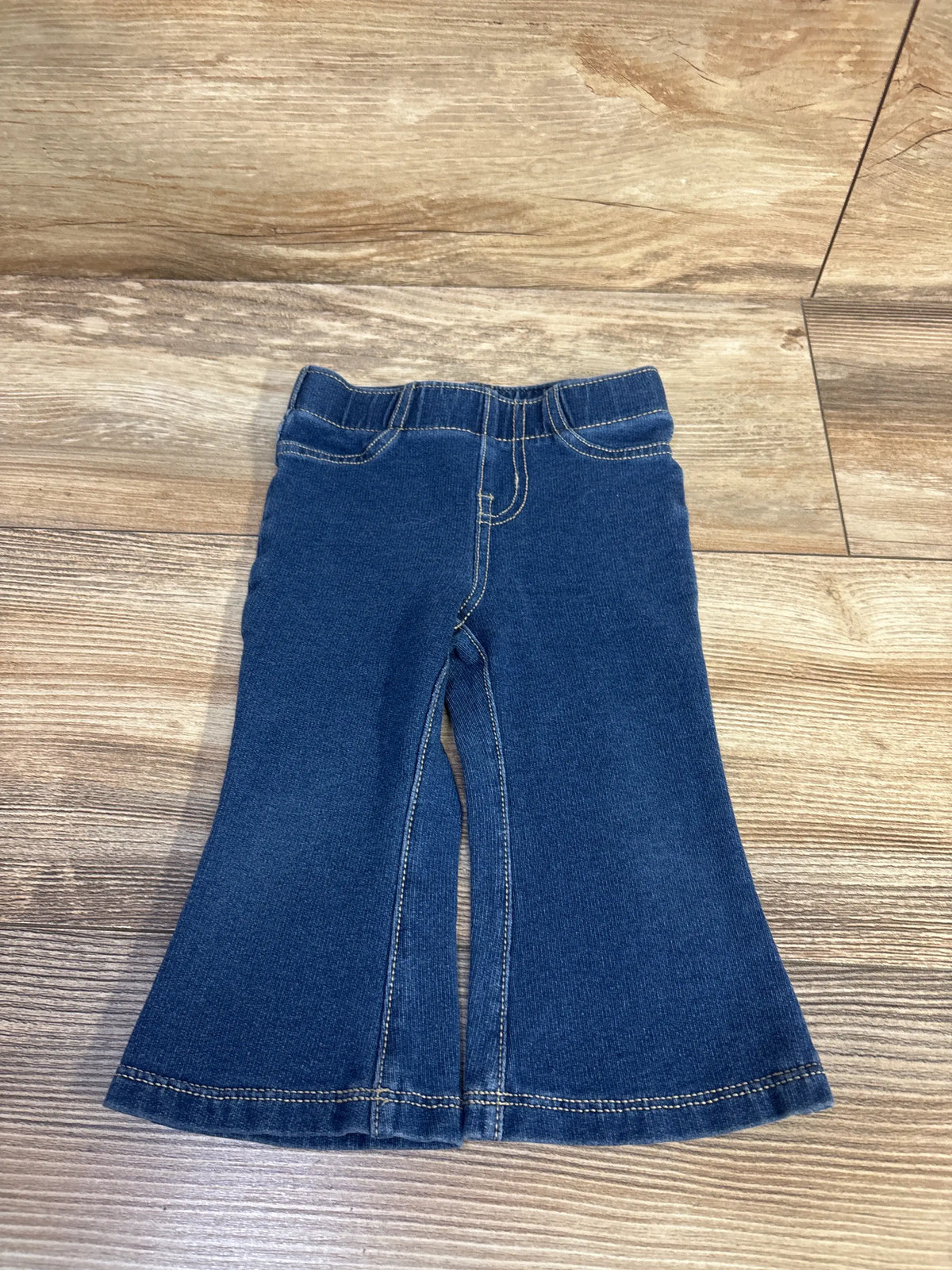 Front view of Cat and Jack blue pull on flare jeggings for size 12 months with elastic waistband and flared legs