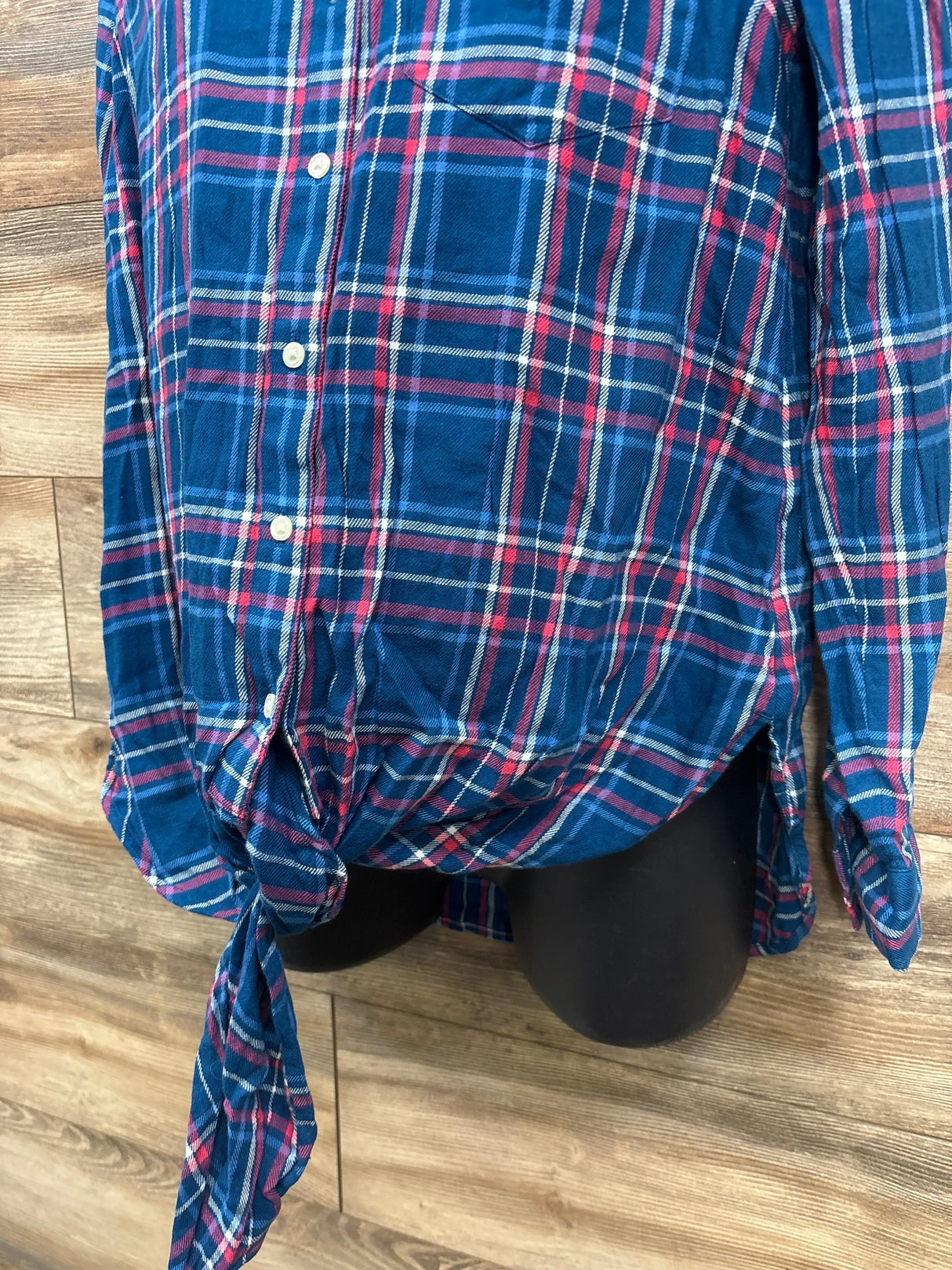 Blue and red plaid maternity shirt with front tie displayed on mannequin