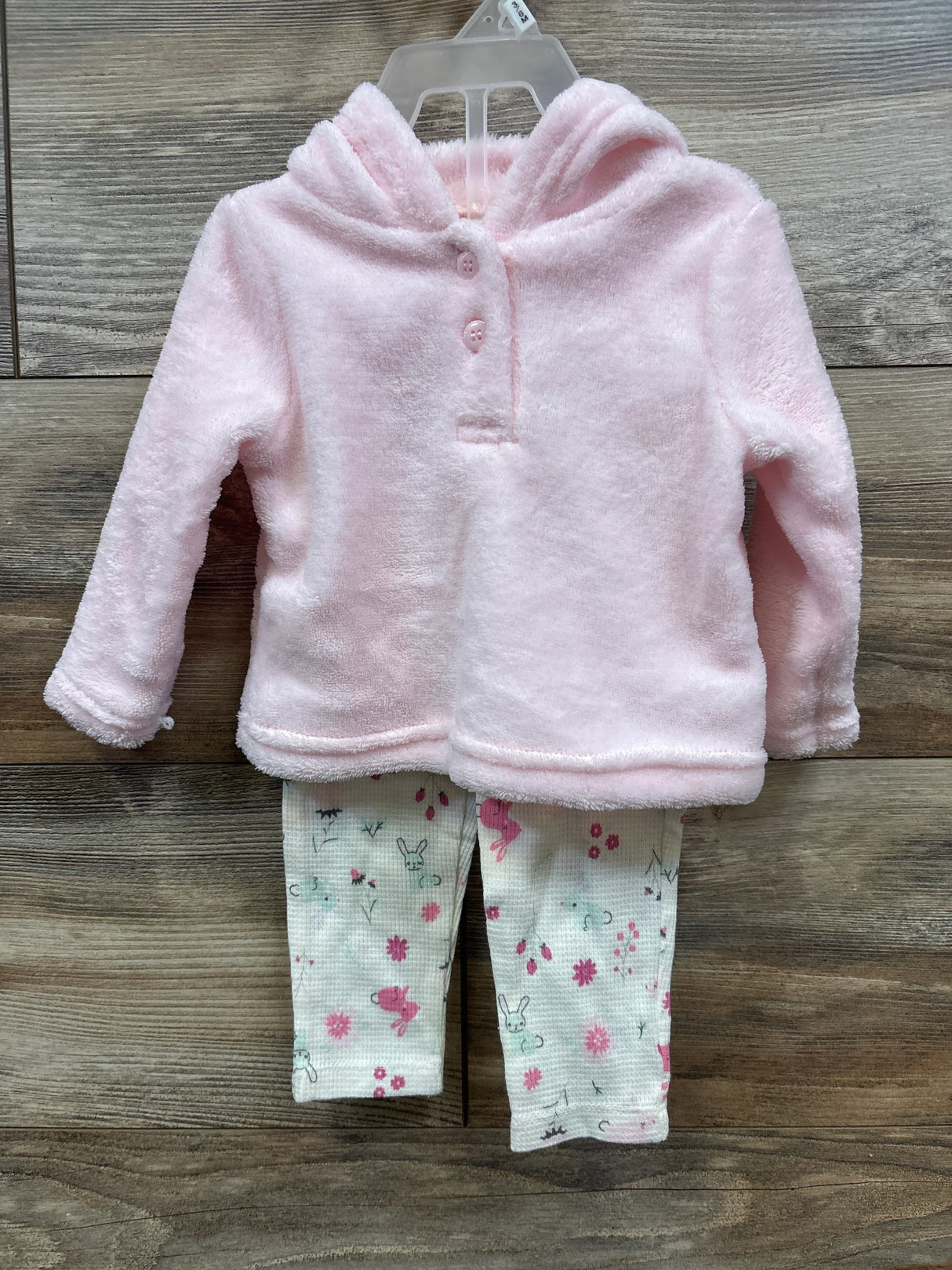 Infant outfit with soft pink hooded fleece top and white leggings with pink and gray floral and bunny prints