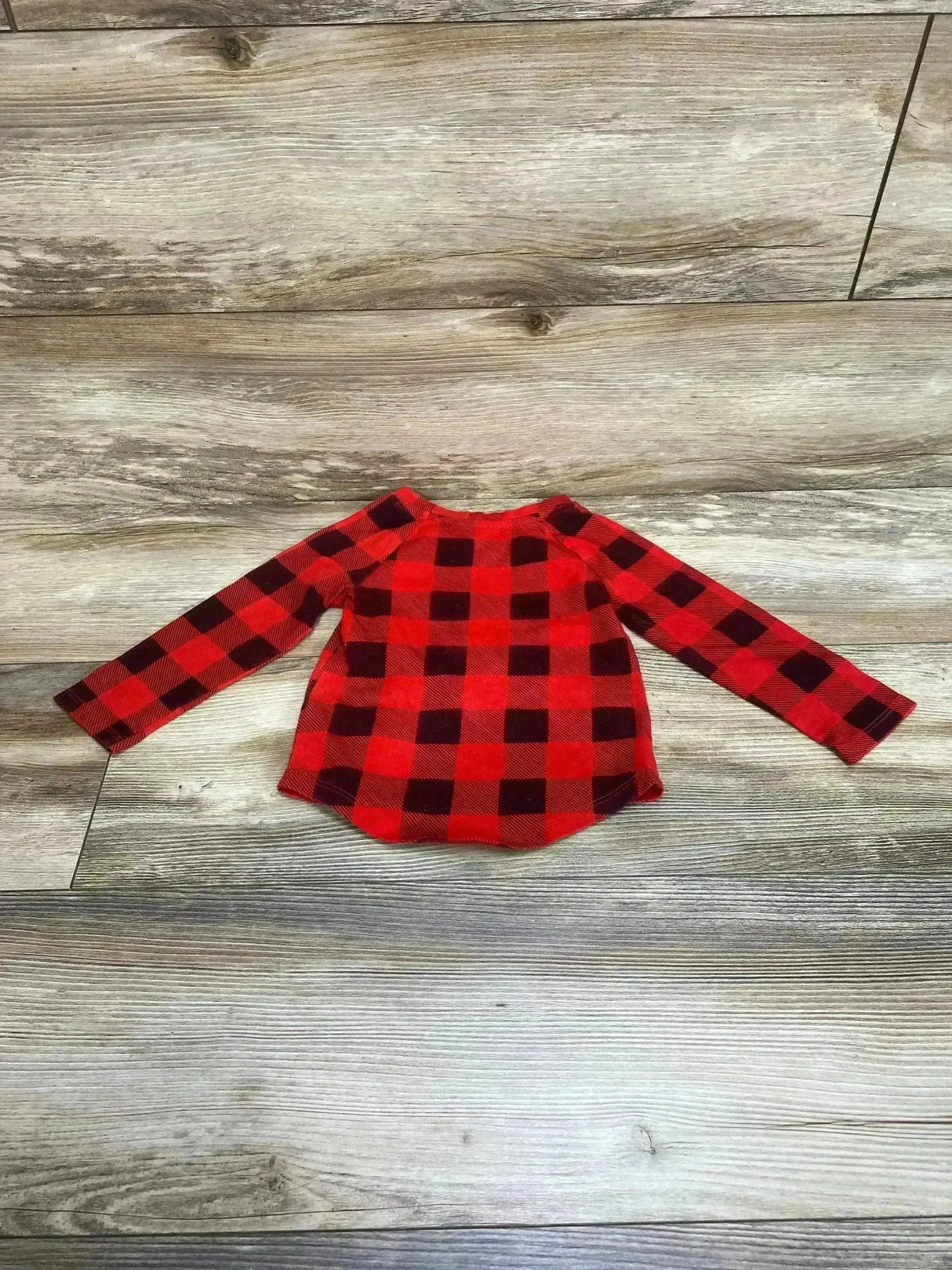 Front view of toddler red buffalo check button-down shirt showcasing collar and long sleeves on white background