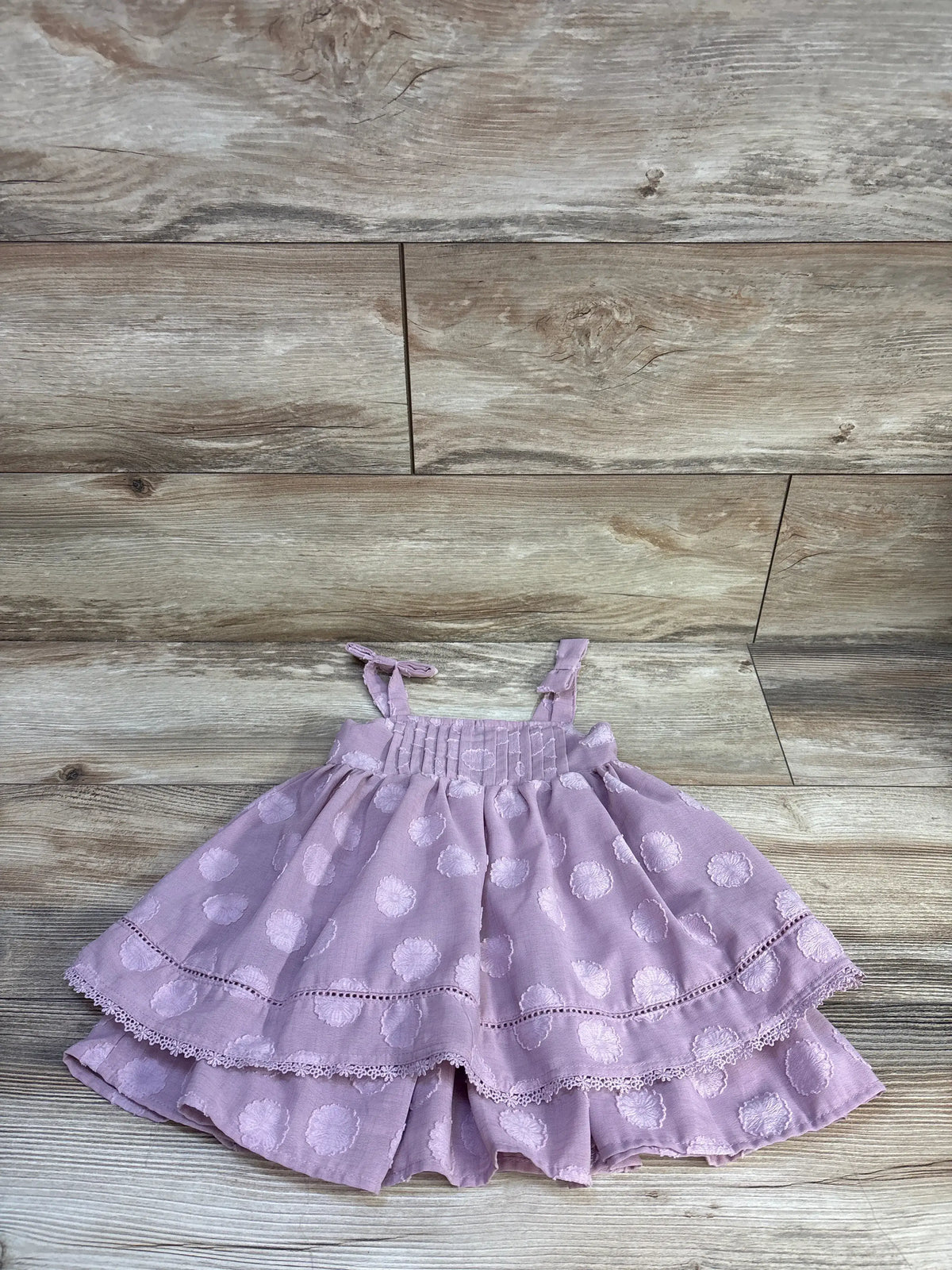 Front view of Sincerely Jules purple layered sleeveless dress, size 18 months, with floral pattern and lace trim