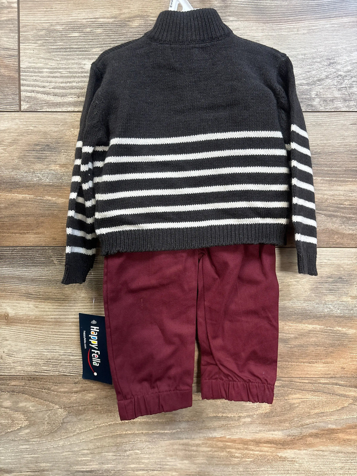 Back flat-lay of baby 2-piece set showcasing charcoal gray striped quarter-zip sweater and burgundy pants on wood floor