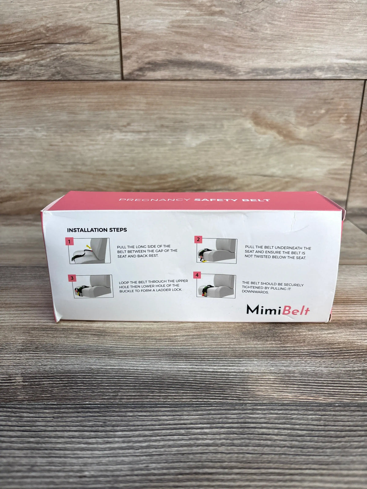 Front view of MimiBelt Pregnancy Safety Belt packaging showcasing four installation steps on a wood-grain surface